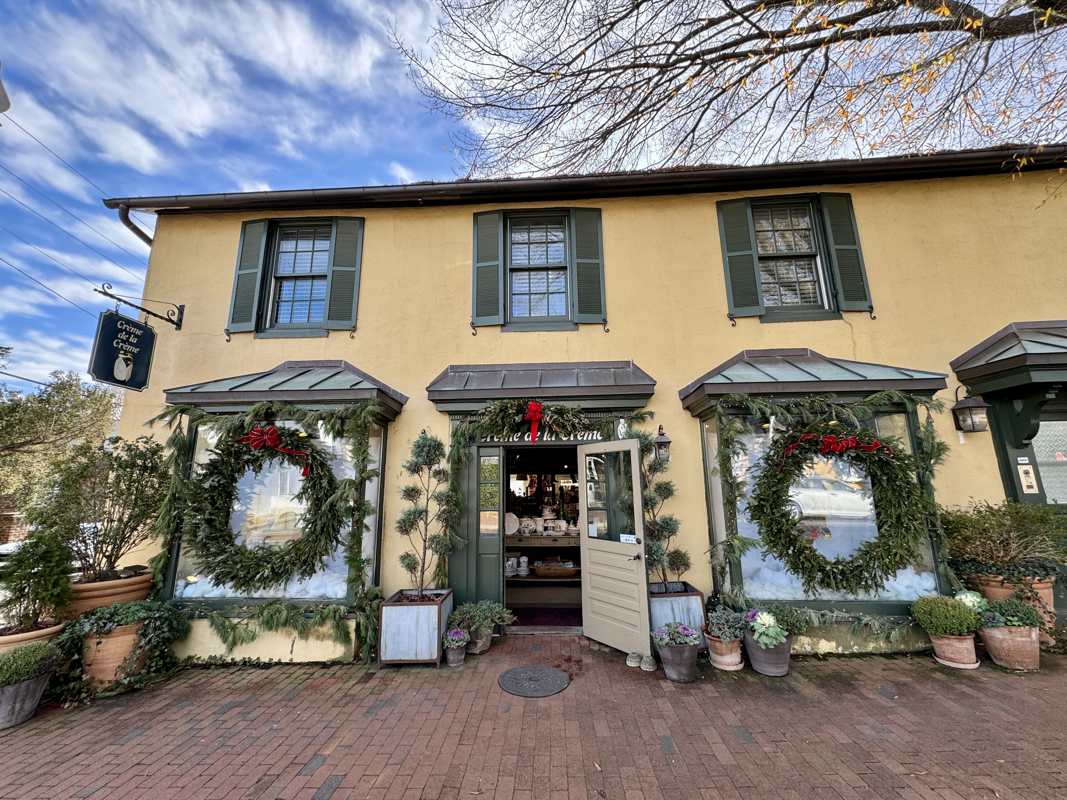 Charming store decorated in live garland and Christmas wreaths