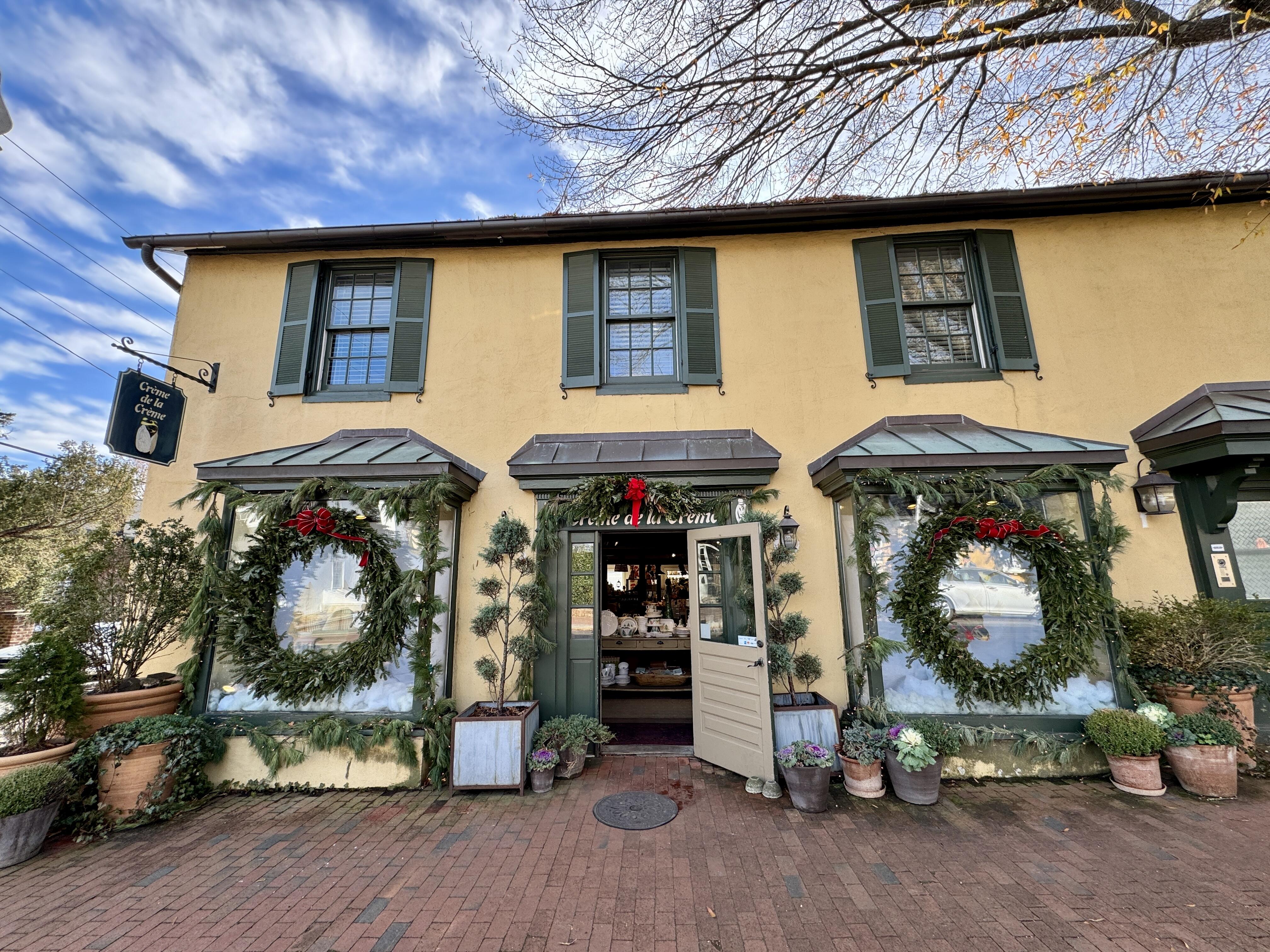 Charming store decorated in live garland and Christmas wreaths