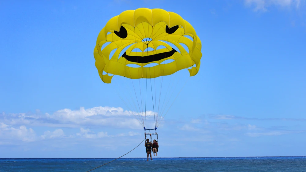 Two people parasailing in Hawaii Kai Bay, Oahu.