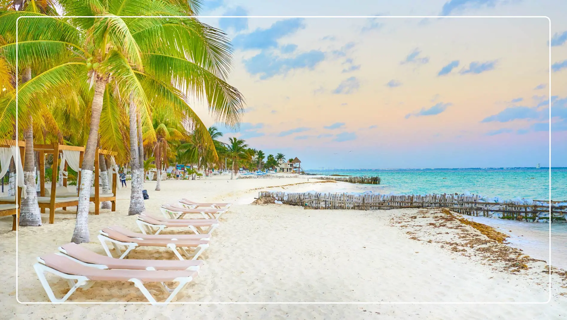 Sun loungers on the beach in Playa Mujeres, Mexico.