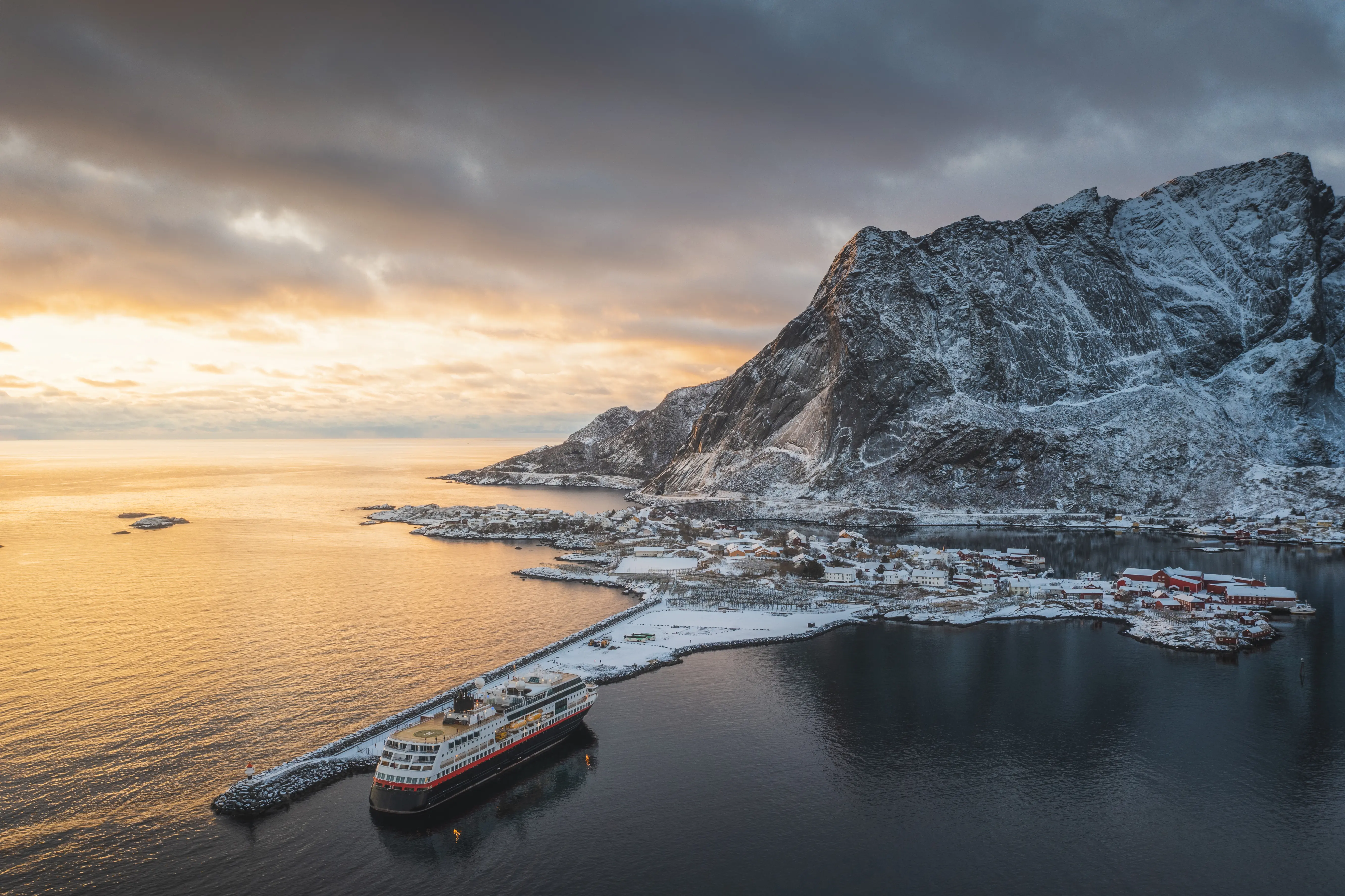 Image of a cruise ship docked at Reine, Lofoten Islands, Norway.