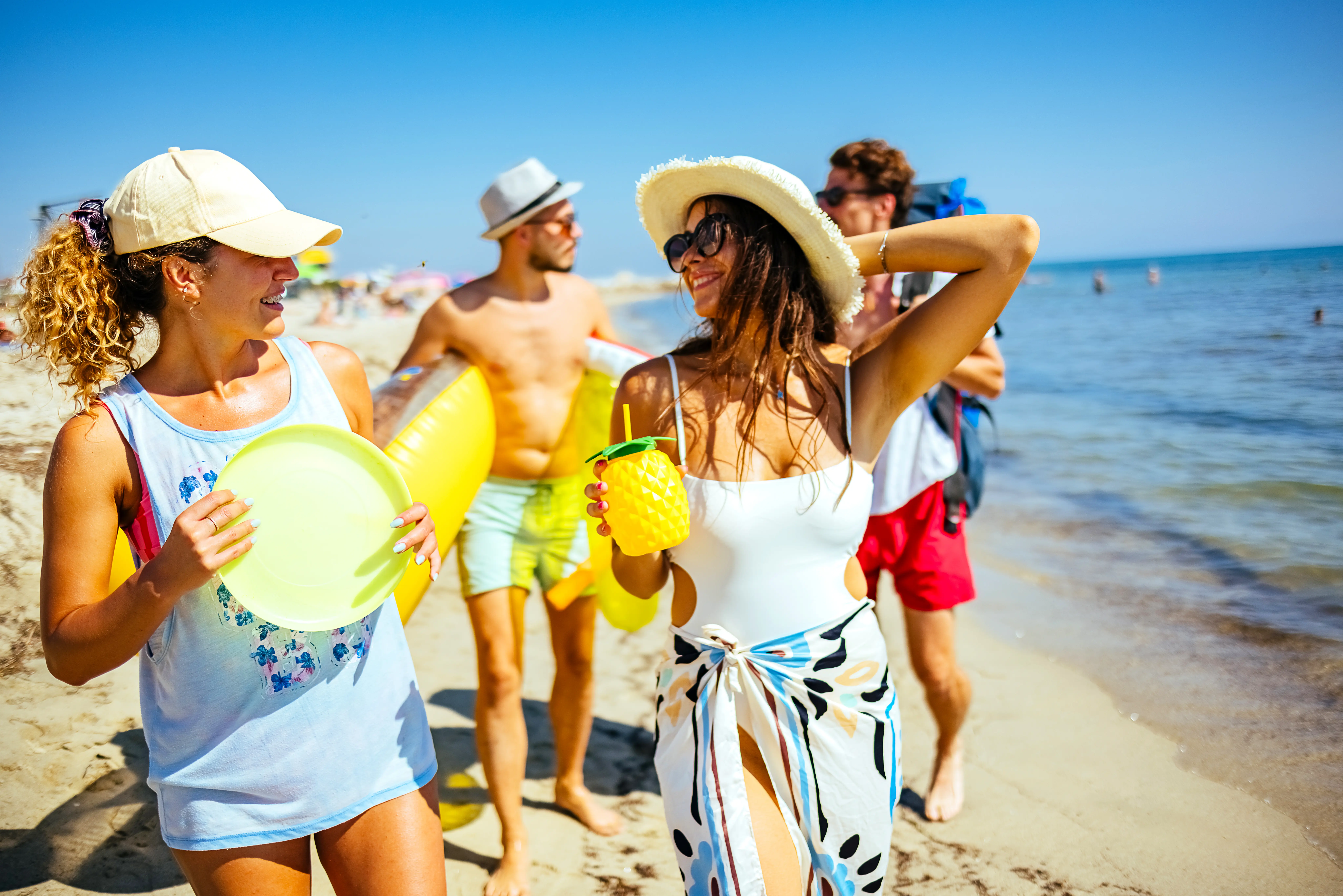 Friends on the beach enjoying the weather and having fun