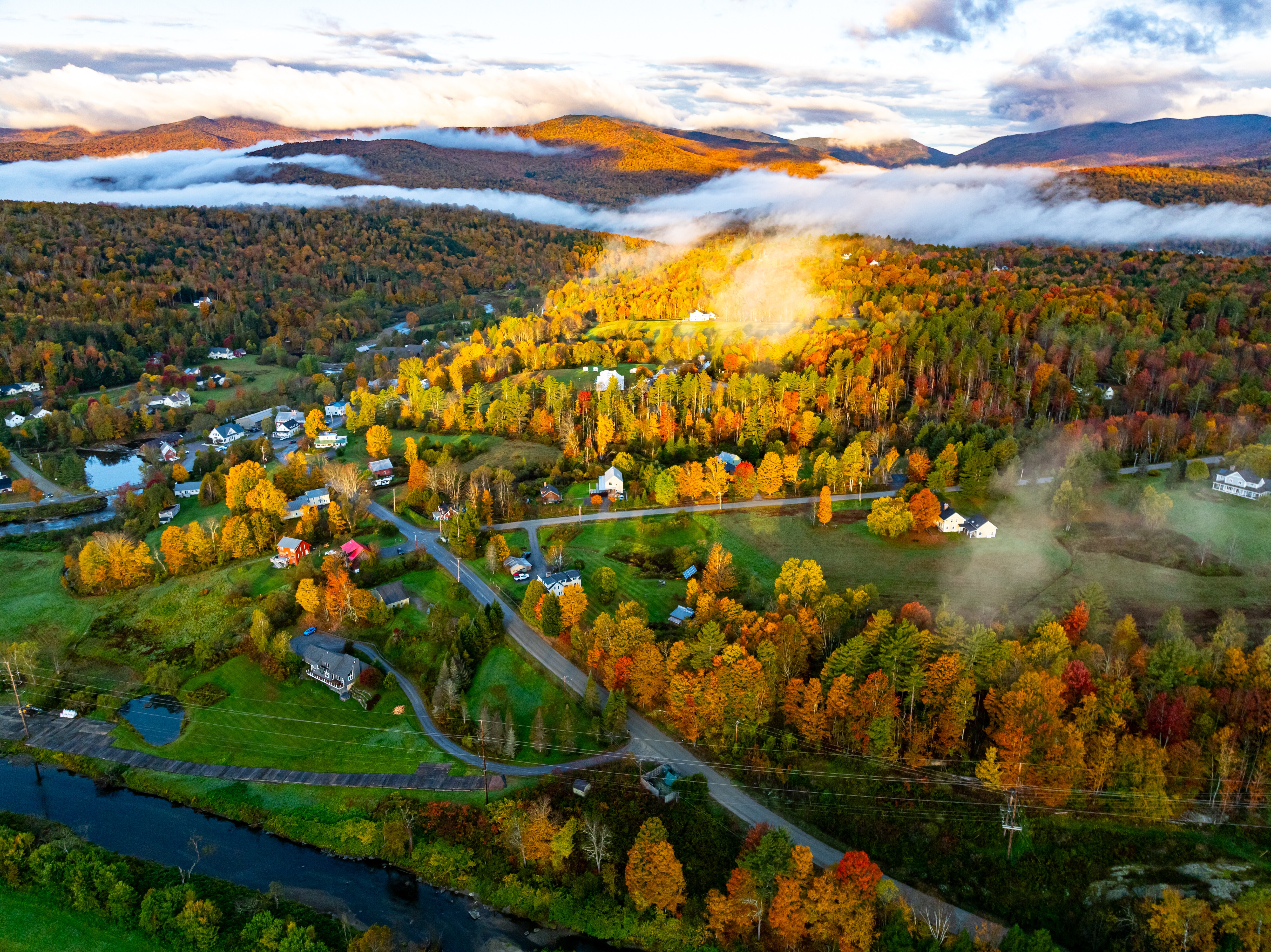 Aerial image of Stowe, Vermont, with its vibrant fall foliage.