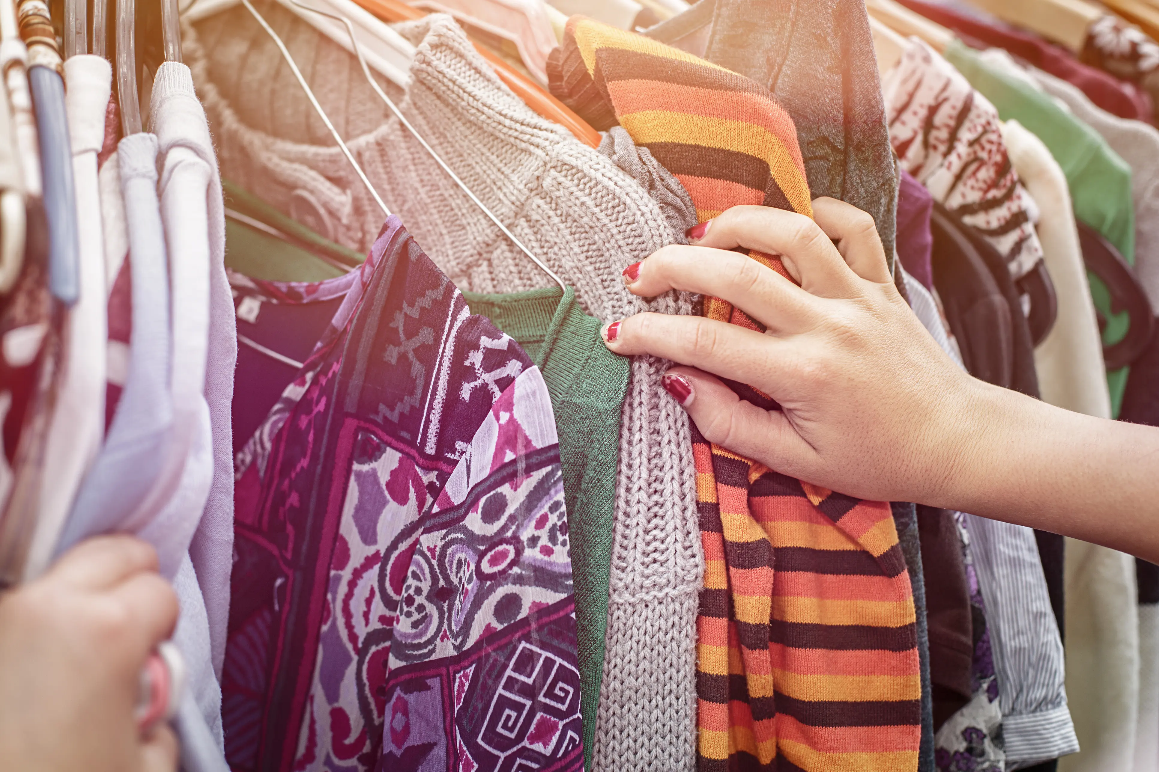 A shopper looking at vintage clothing