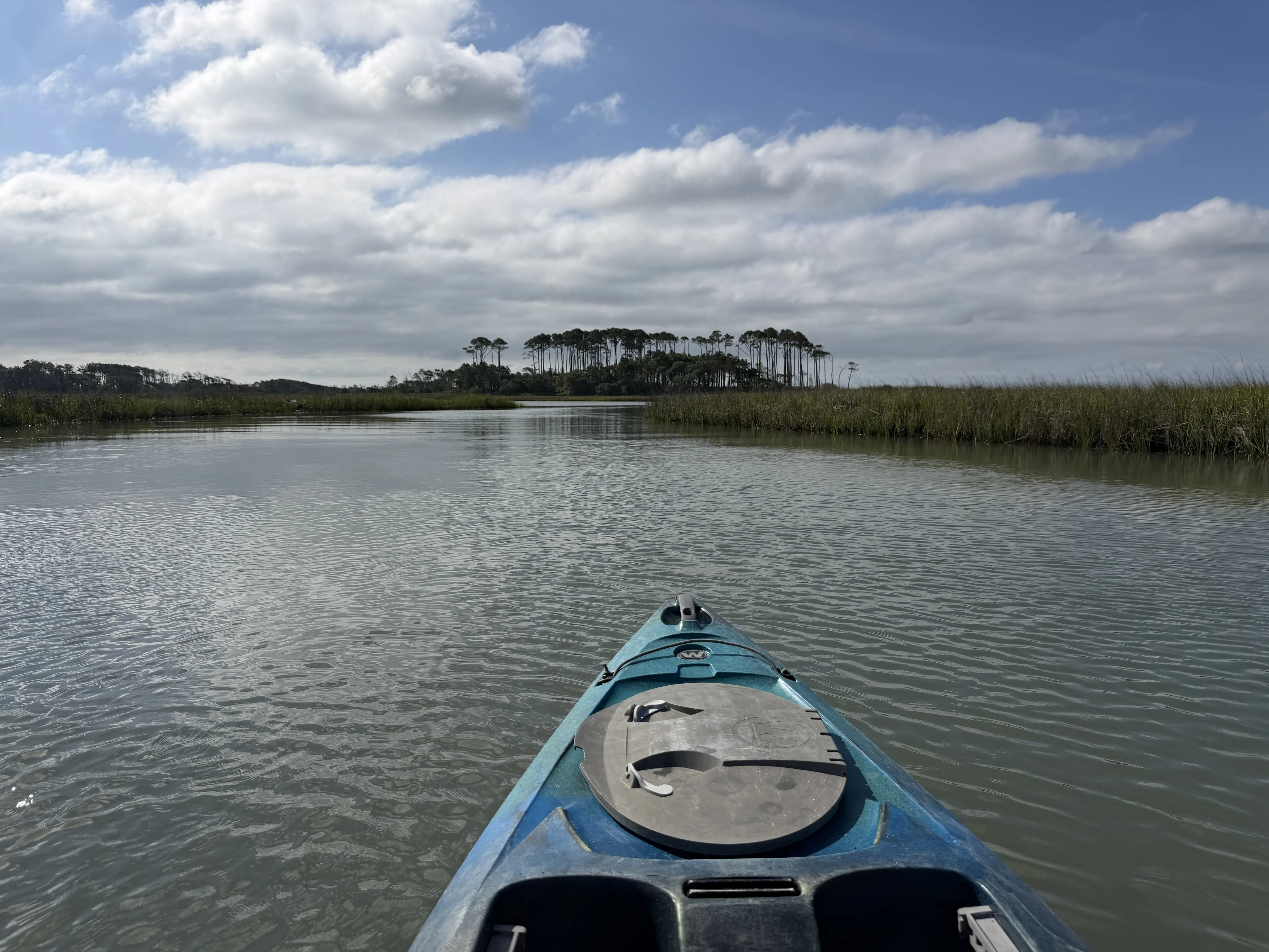 tip of blue kayak is in view as it floats atop the waters in the marsh around Waites Island in North Myrtle Beach