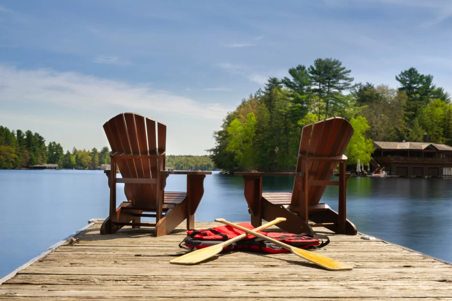 Adirondack chairs on wooden dock