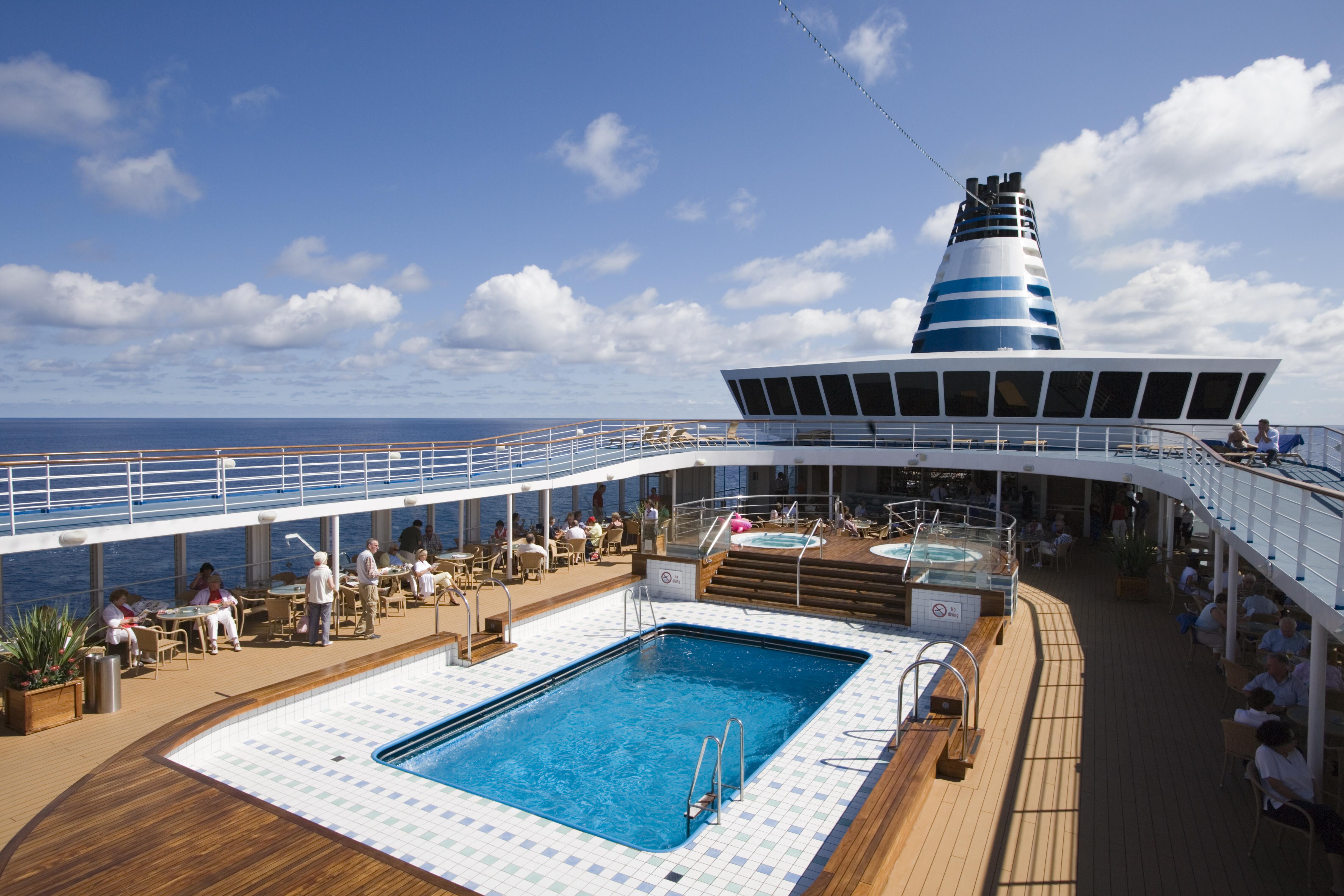 Image of the top deck and pool area of a cruise ship.