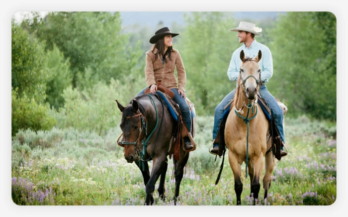 A couple enjoying a horseback ride together