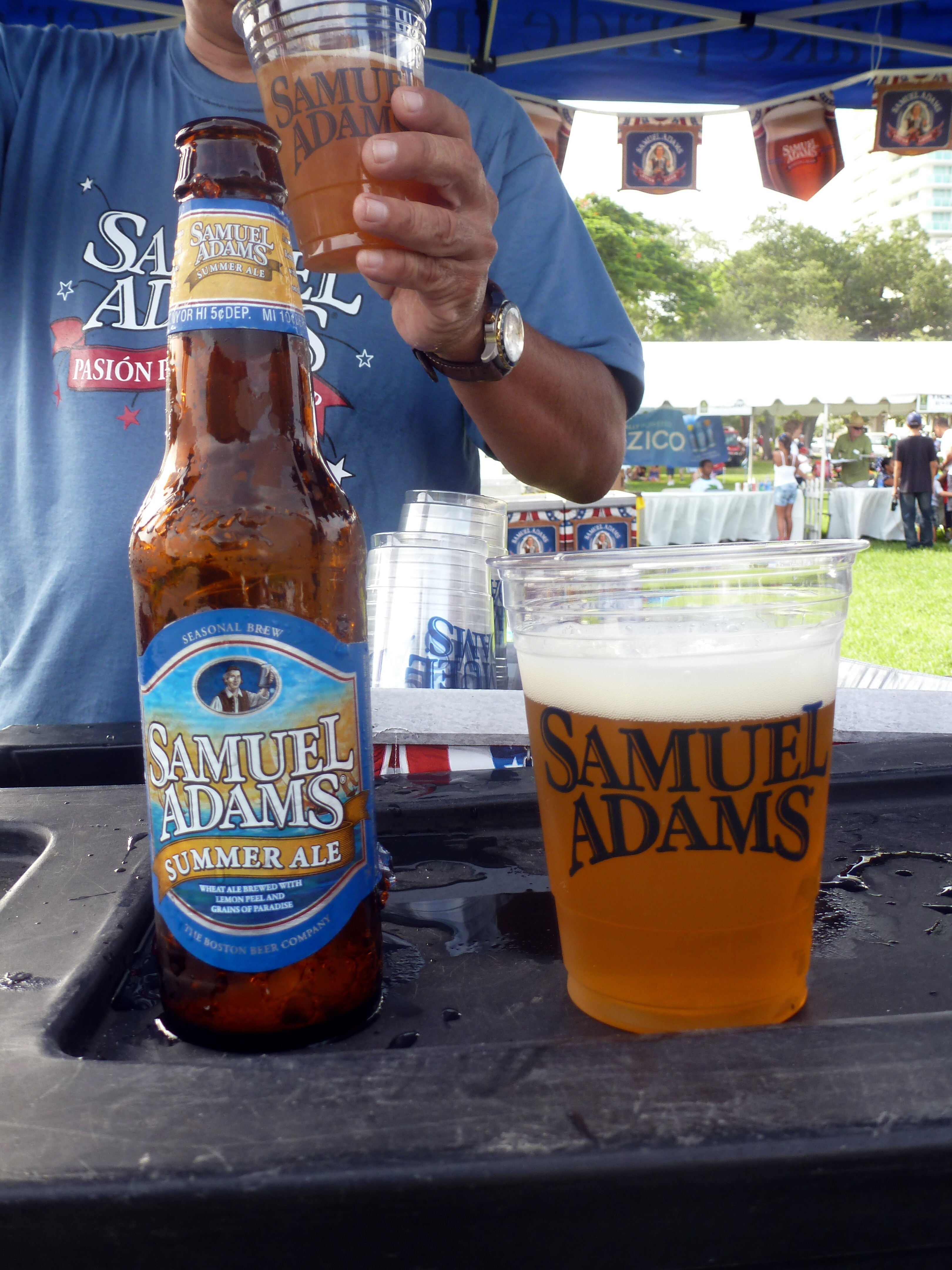 Image of a Samuel Adams Summer Ale bottle, as well as in a branded glass.