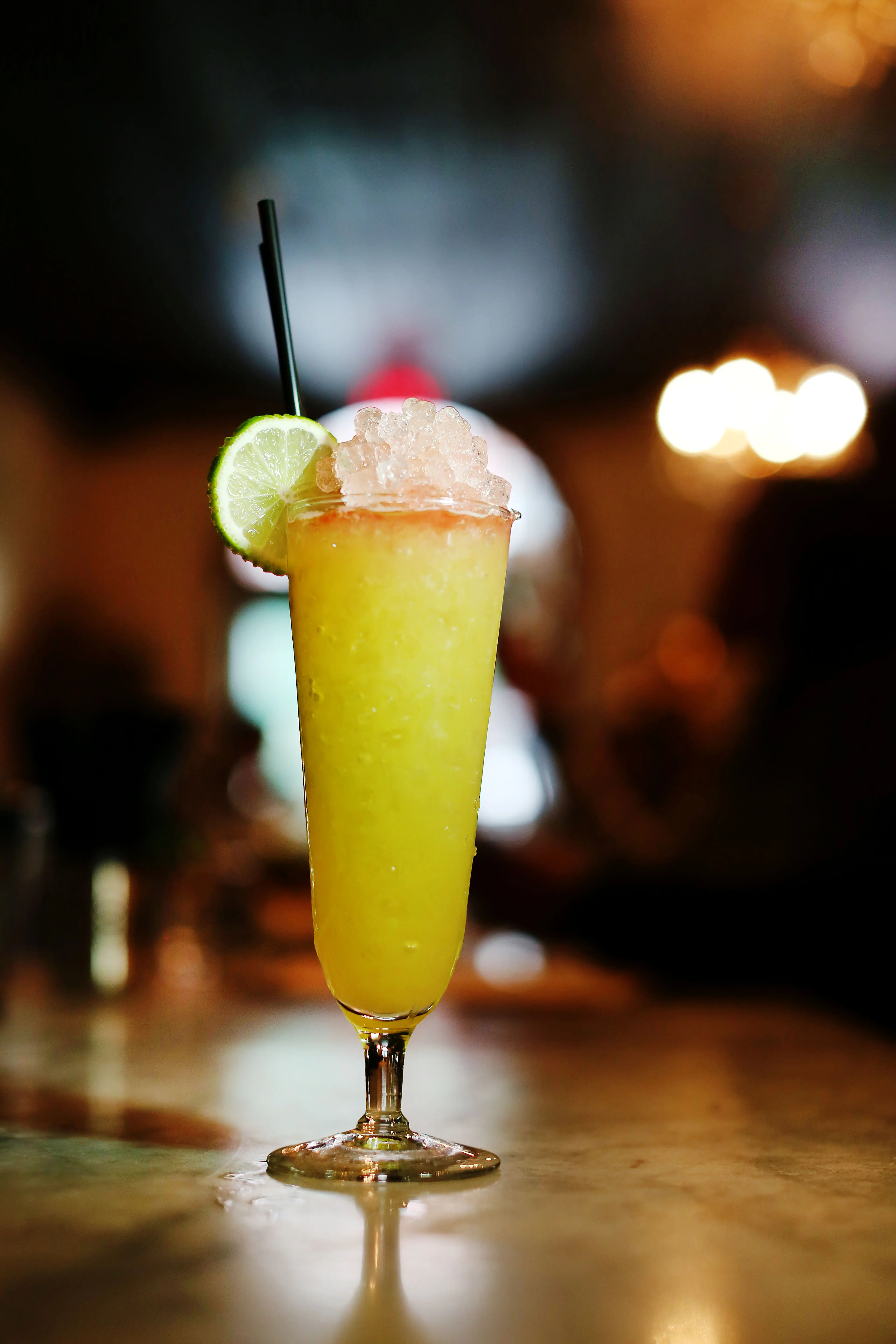 Image of a fruit cocktail in a bar.
