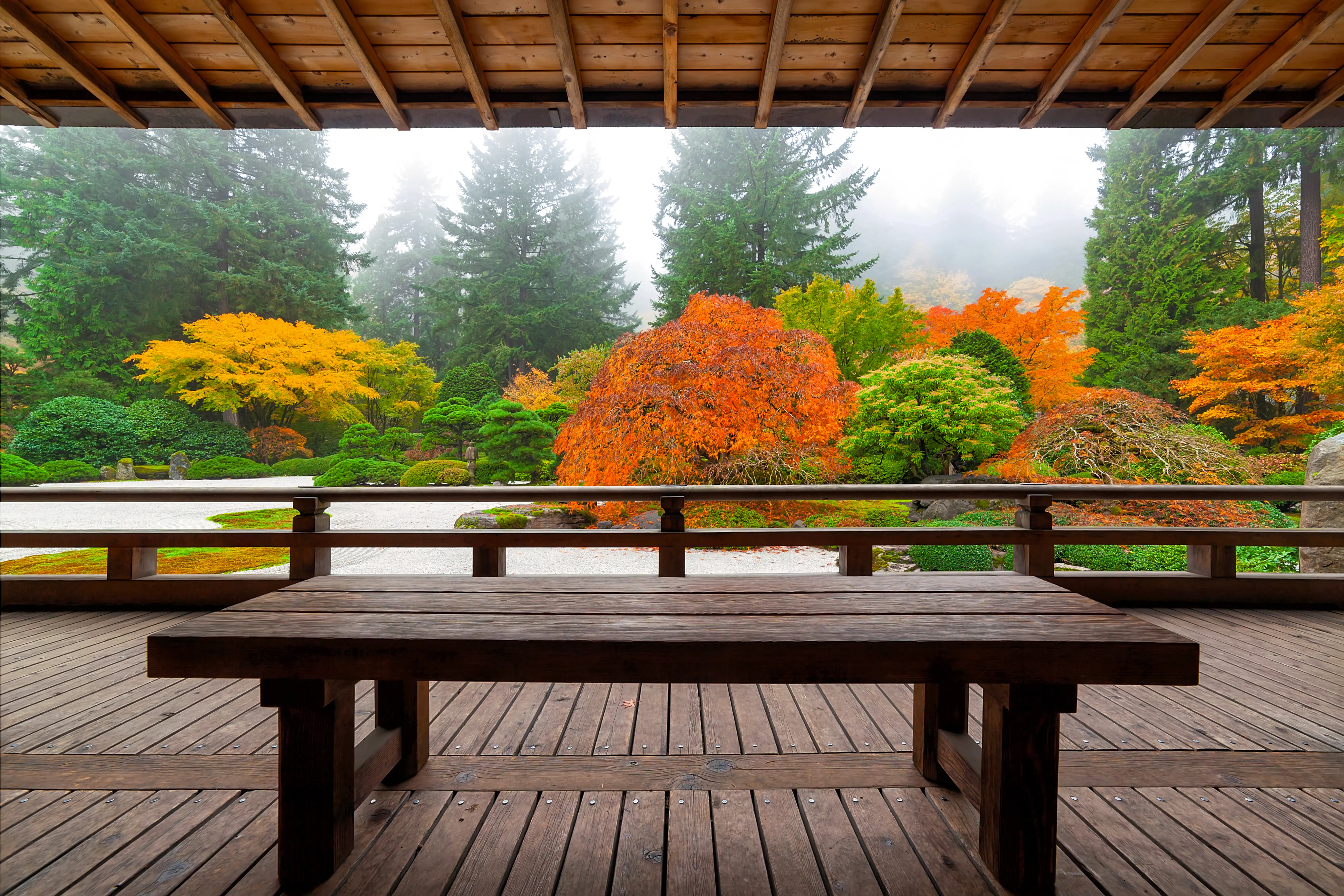 Japanese Garden Pavilion’s view of the Flat Garden with stones, clipped shrubbery and colorful trees
