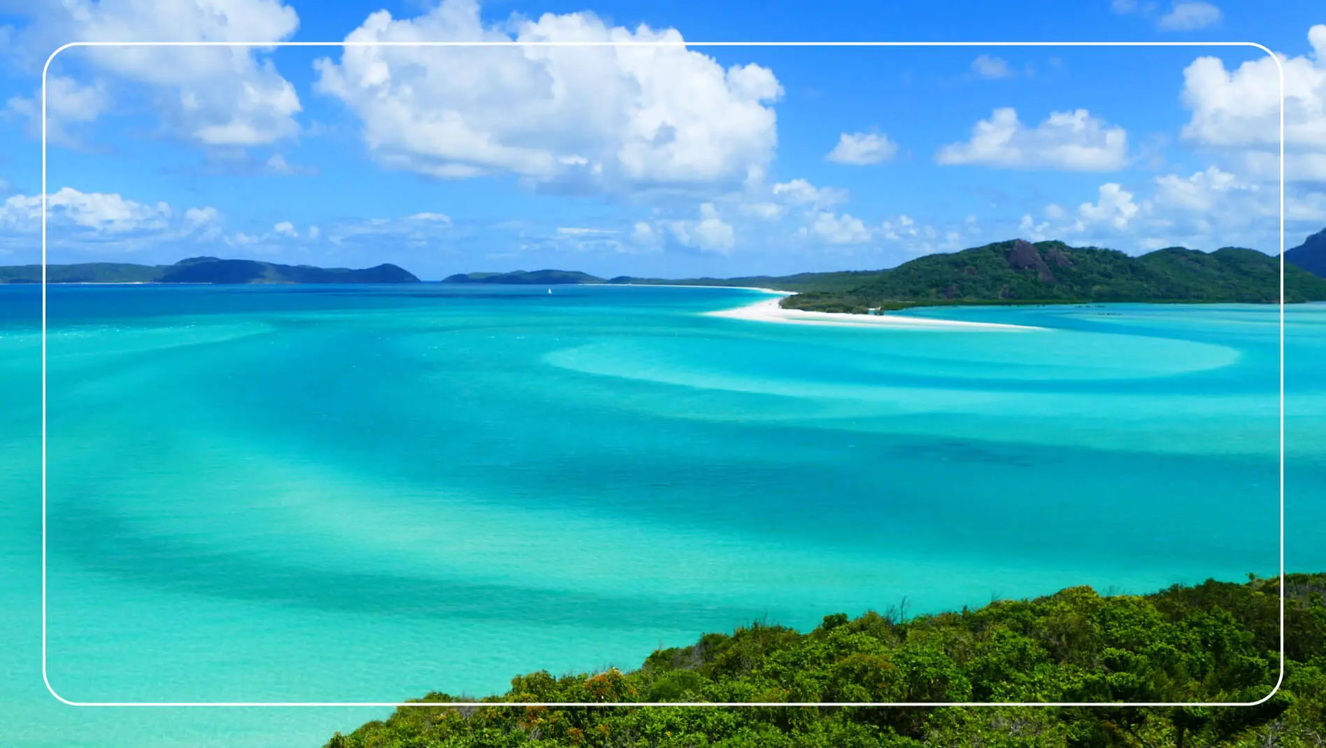 Aerial view showing white sands and azure waters of Whitehaven Beach, Whitsundays