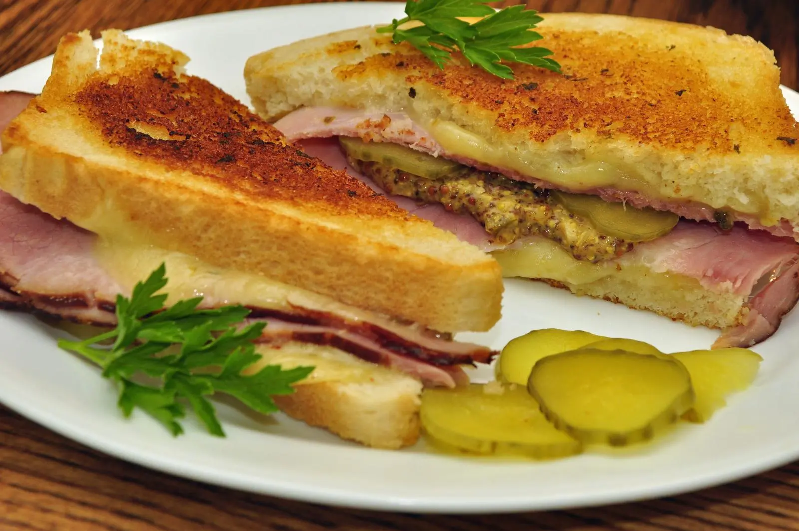Image of a grilled cheese with ham and mustard