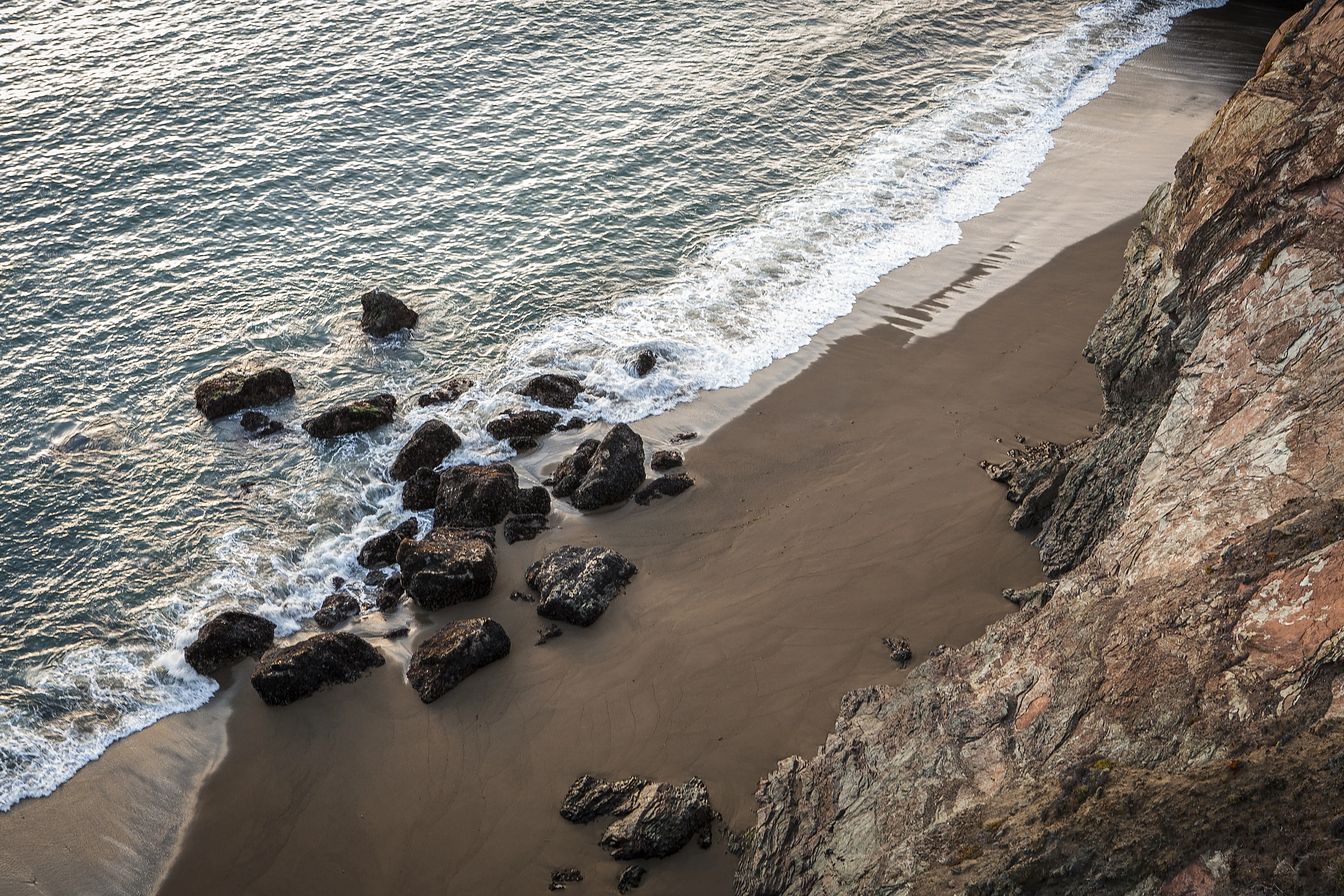 Image of the beach shoreline and ocean of Marin Headlands in California.