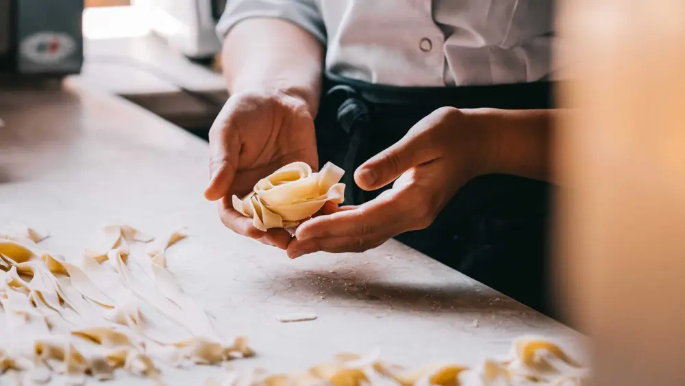 Chef’s hands as they make fresh pasta.