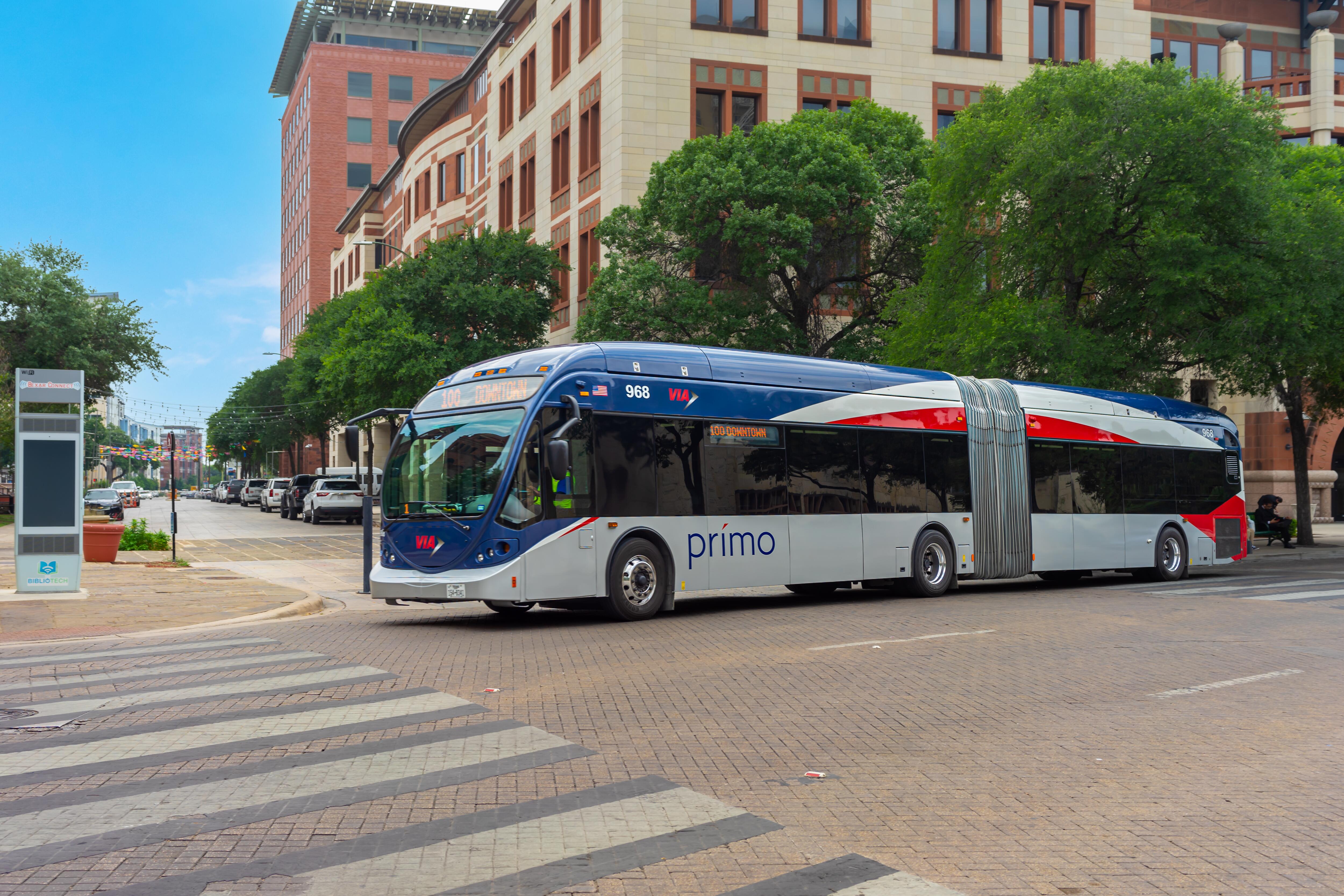 San Antonio, Texas, USA – May 8, 2023: A VIA Metropolitan Transit articulated bus traveling in downtown on Dolorosa Street in San Antonio, Texas.