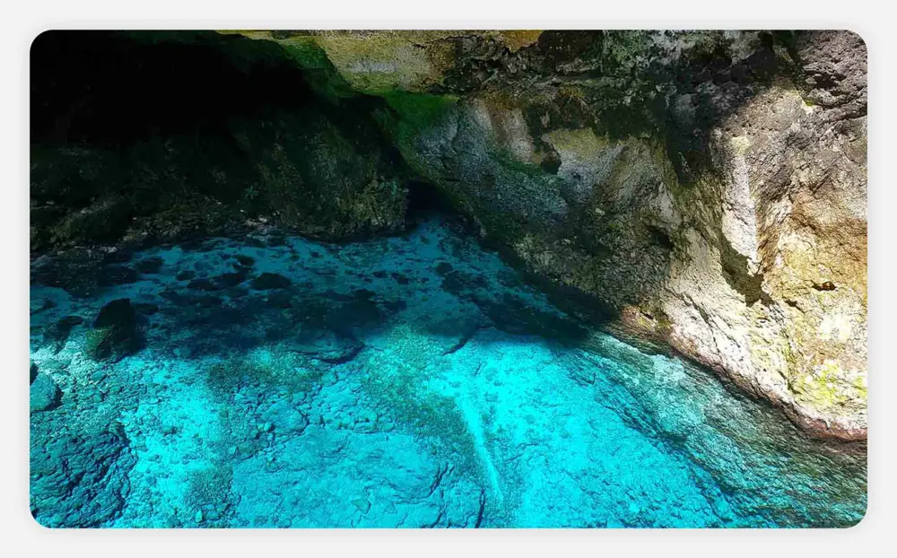 The blue waters of Hoyo Azul Lagoon in Scape Park, Punta Cana.