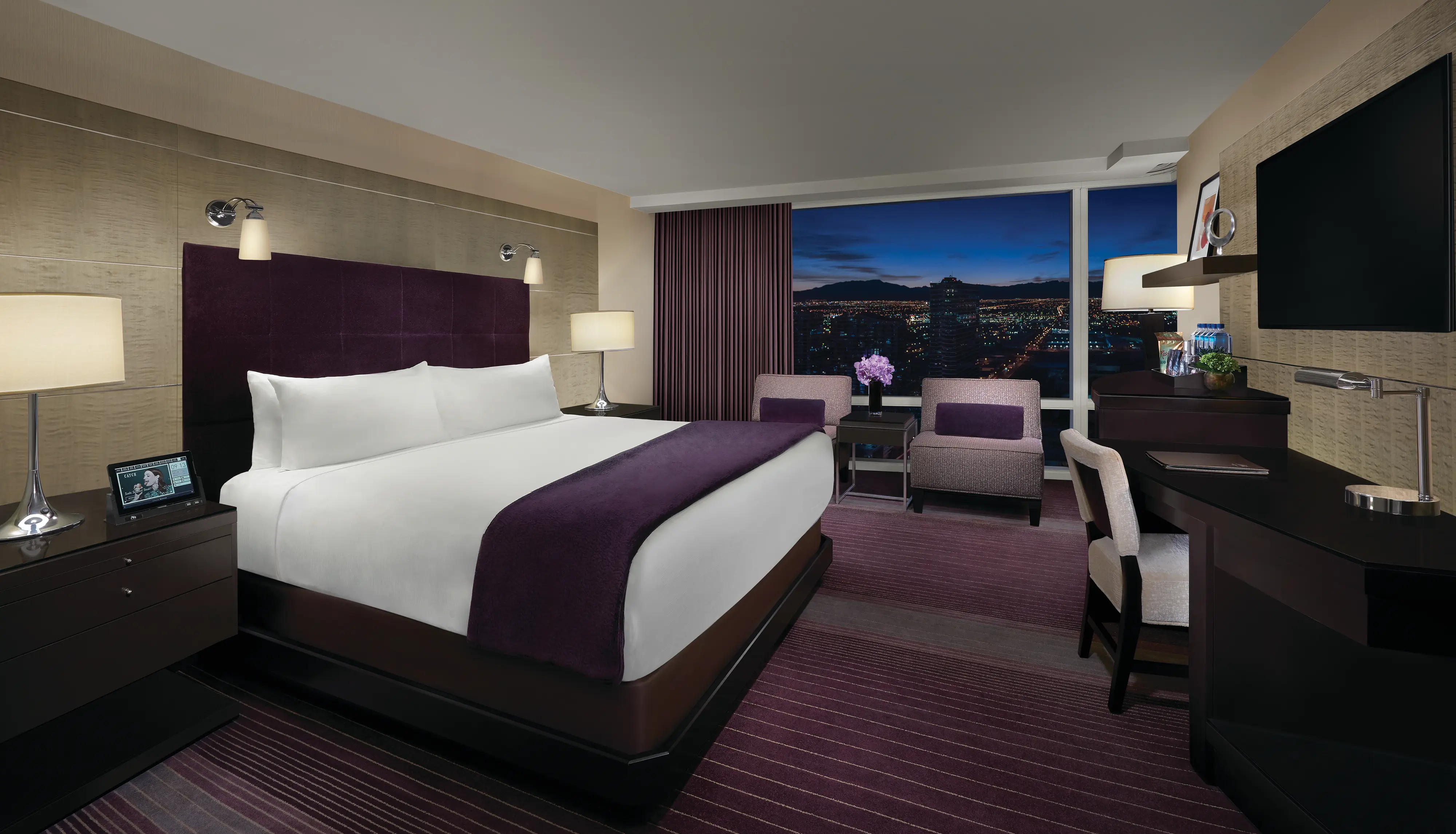 Hotel room with view of night sky and mountains