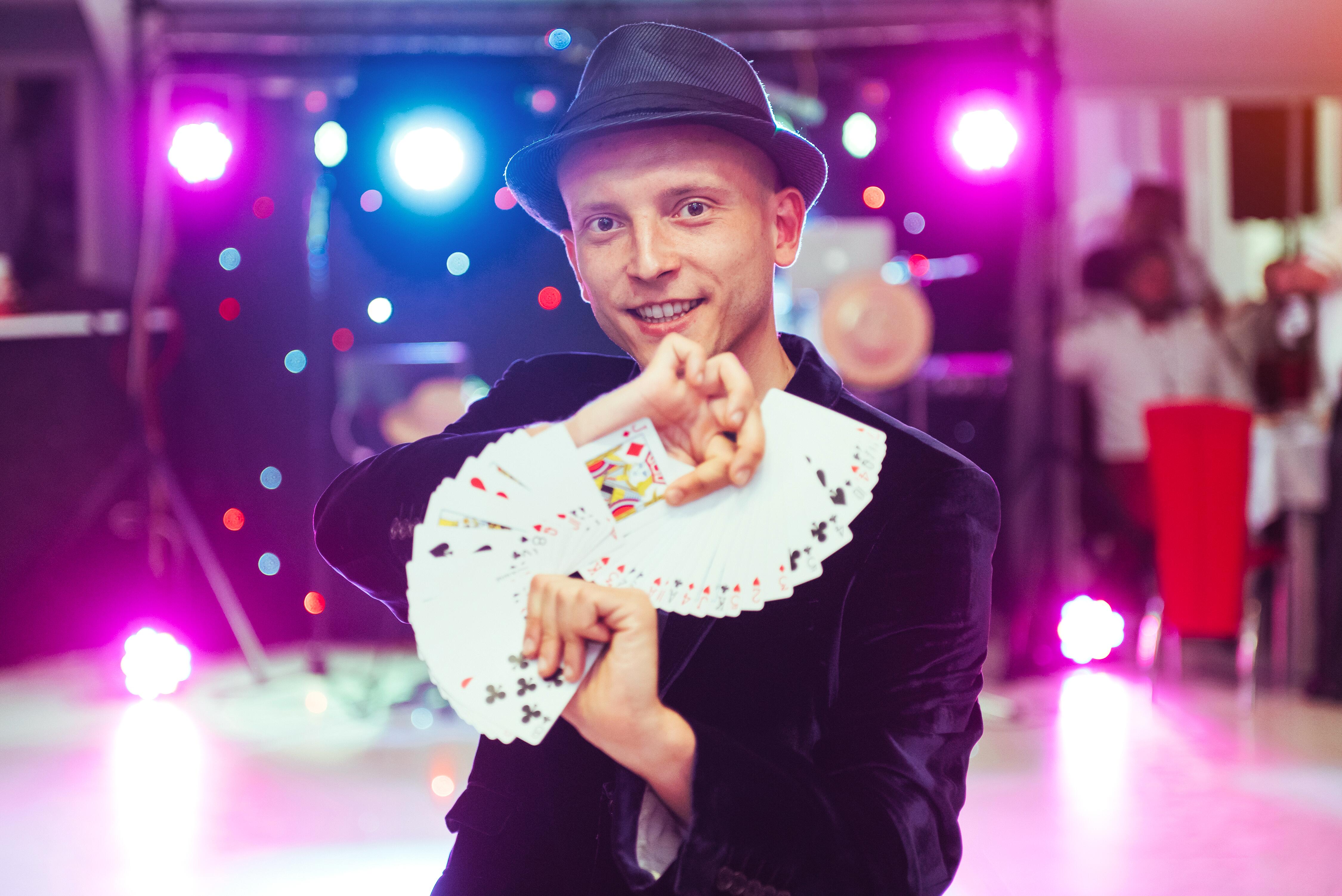 Magician presenting a card trick