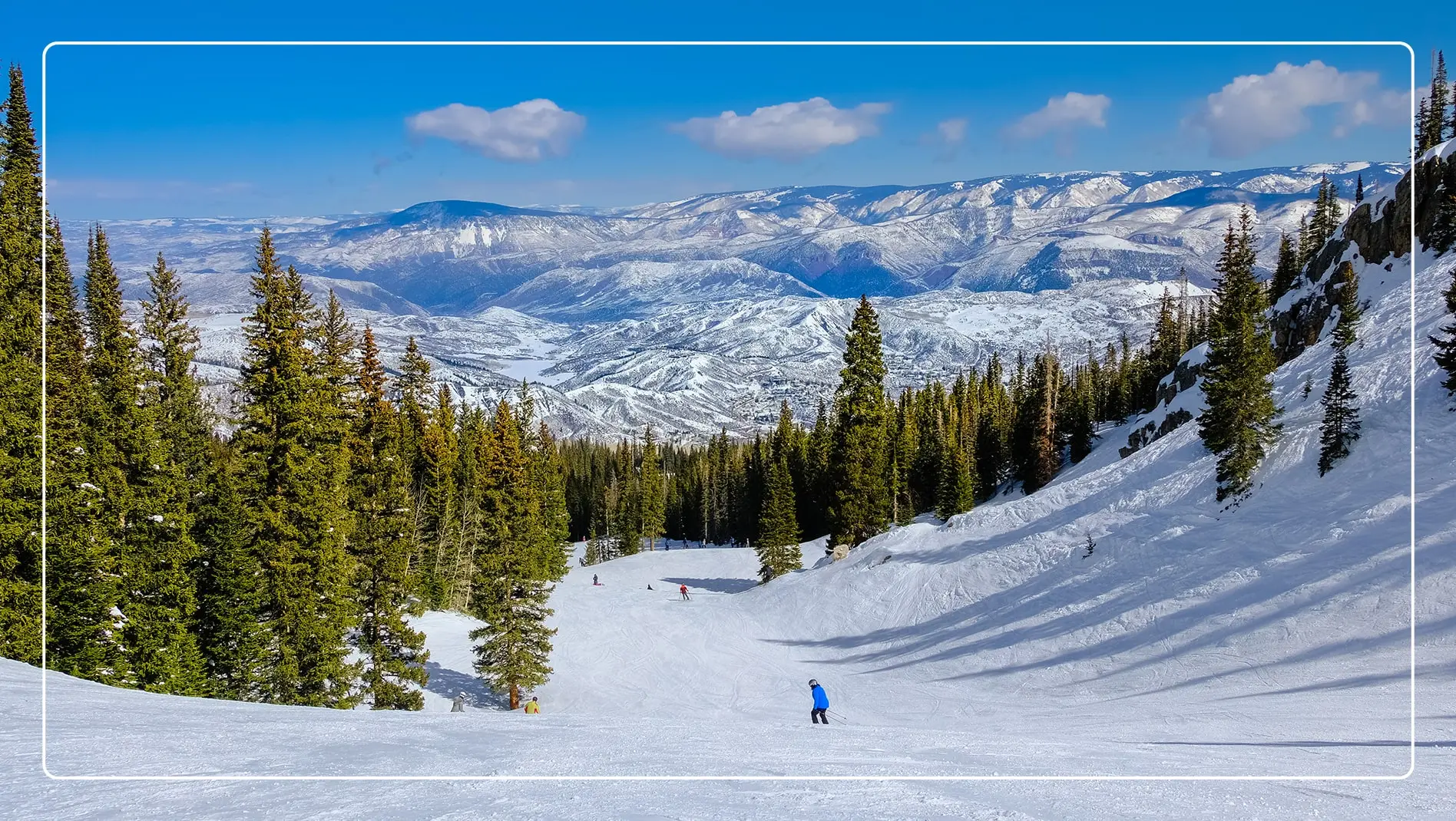 Snowboarders on a ski run in Aspen, Colorado.