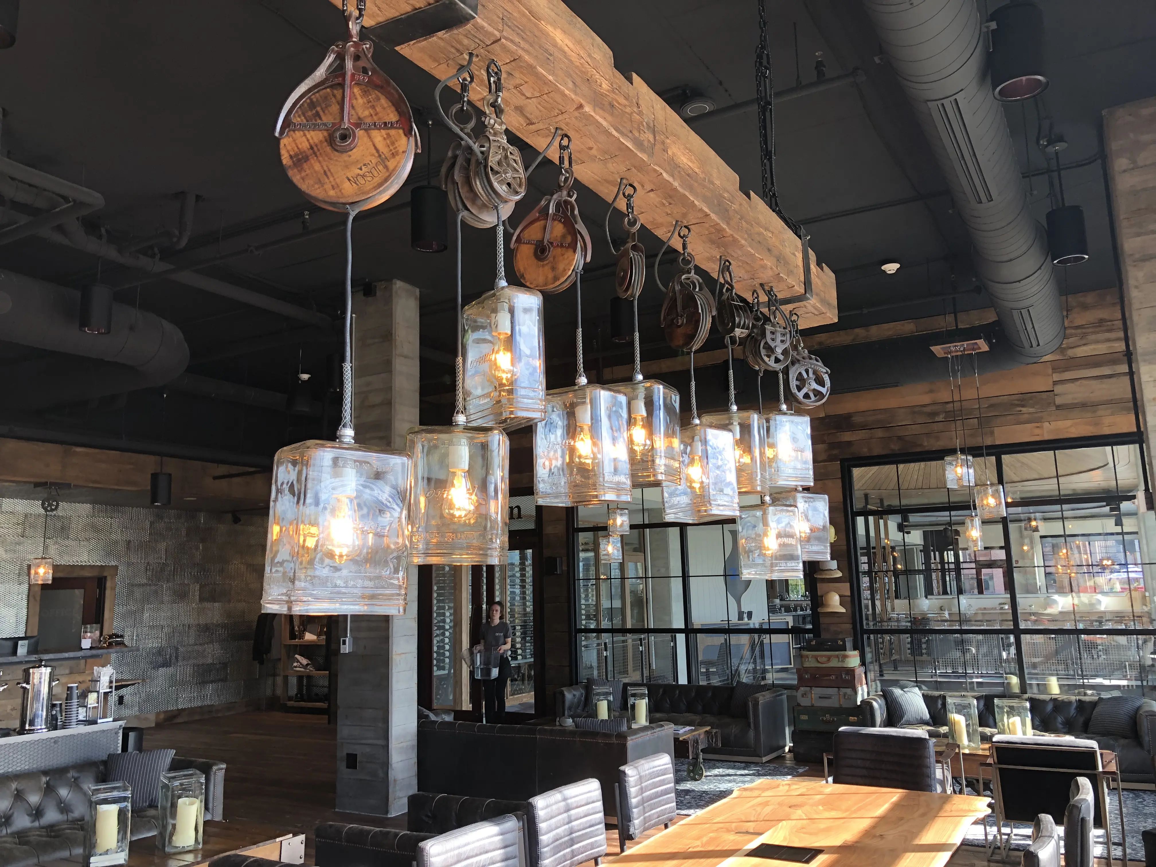 Barn wood and industrial lighting in the lobby of the Ironworks Hotel Indy in Indianapolis, Indiana.