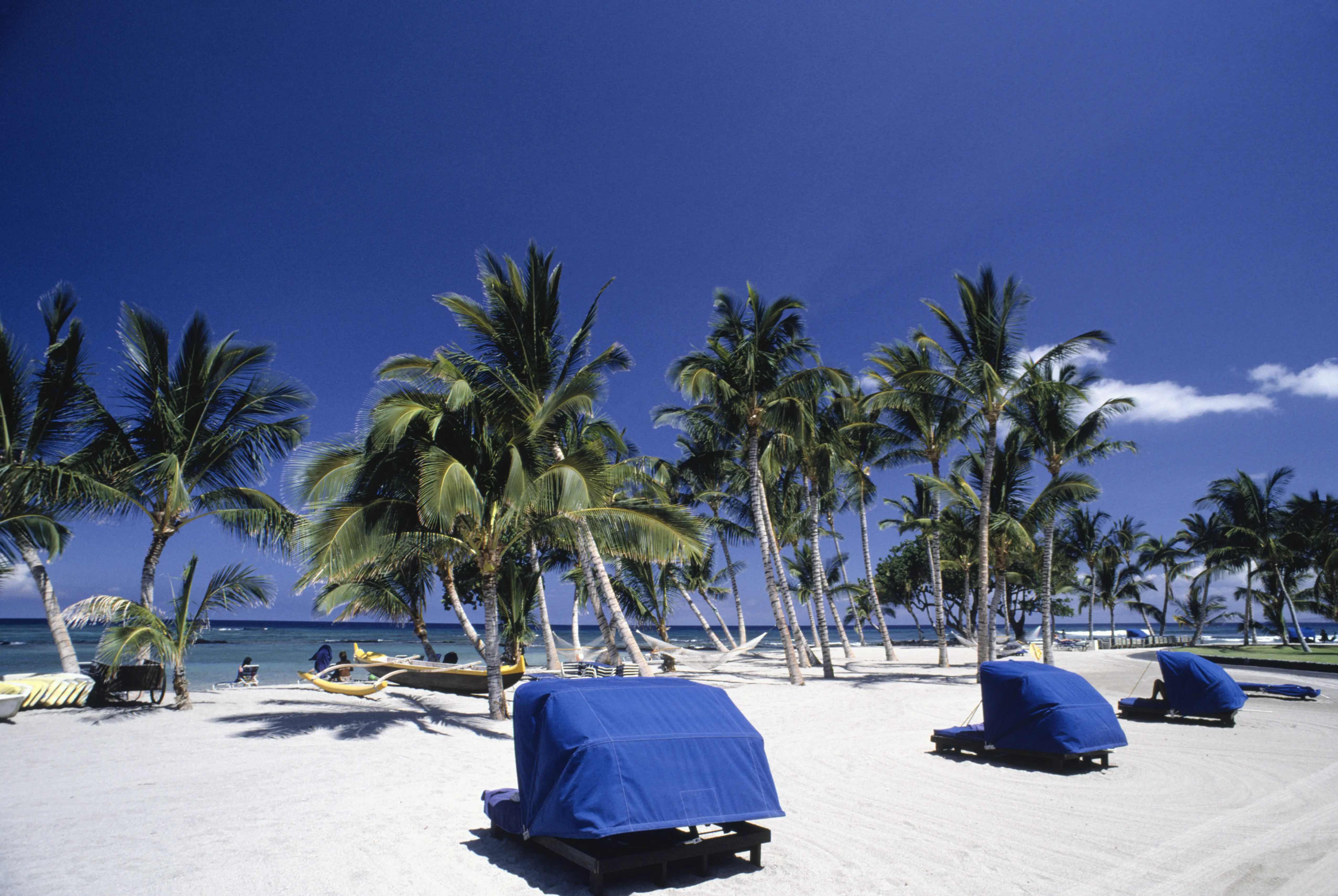 Image of shaded sun loungers on Mauna Lani Bay.