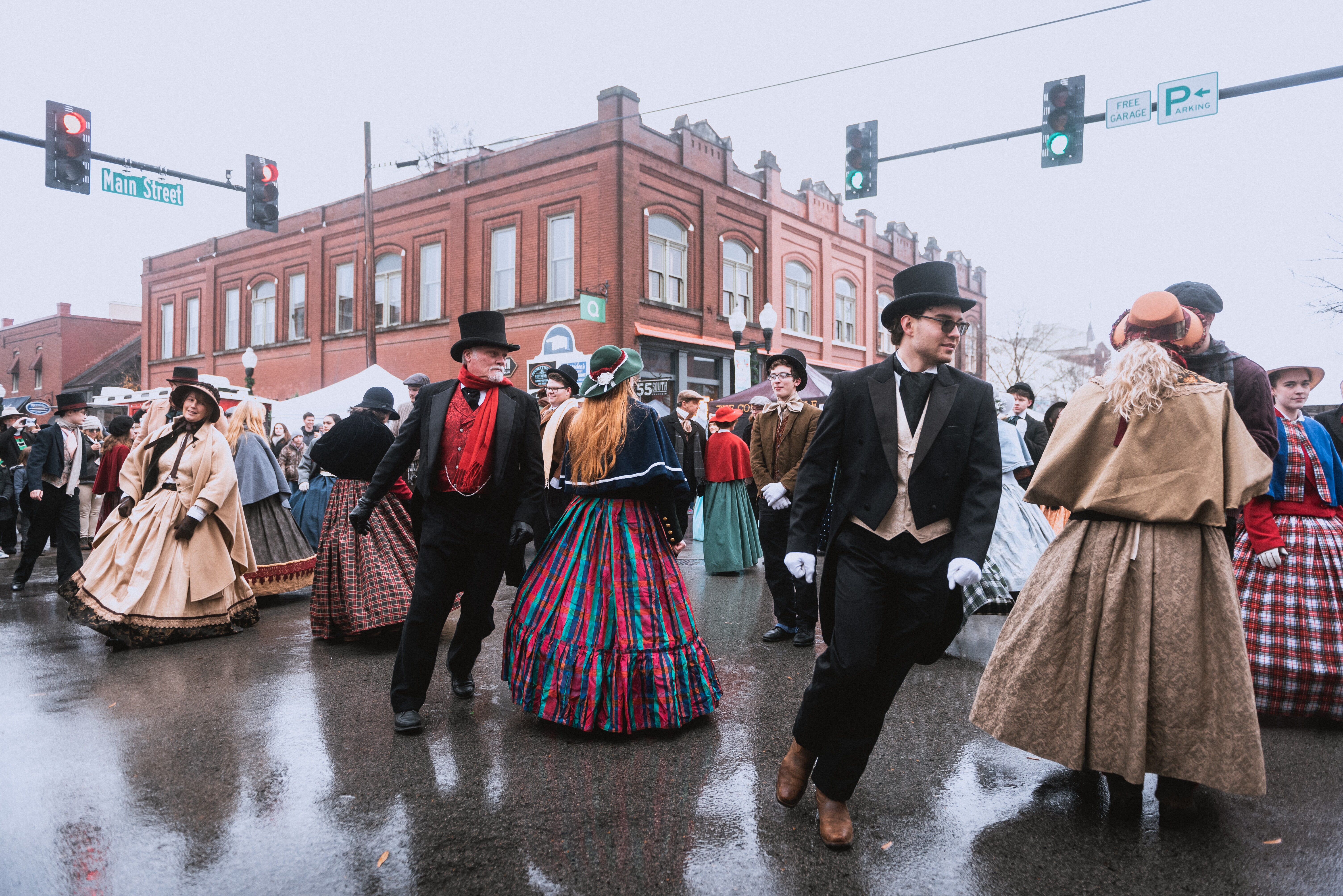 Costumed re-enactors dance in the streets of Franklin, Tennessee, during the Dickens of a Christmas festival
