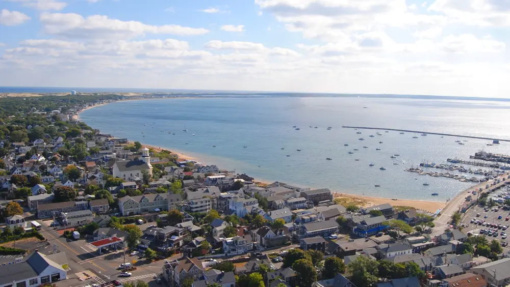 A view of Provincetown, a popular day trip from Boston, with the water in the background.