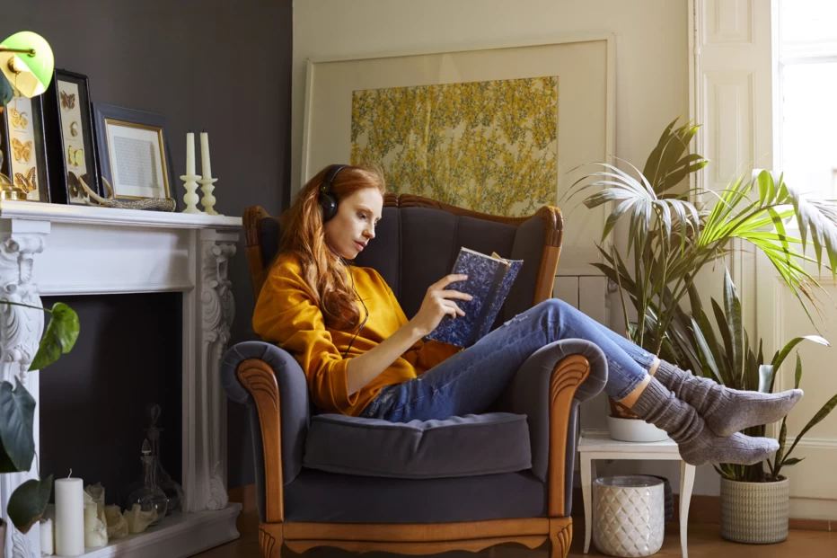 Woman reading Travel Book at home