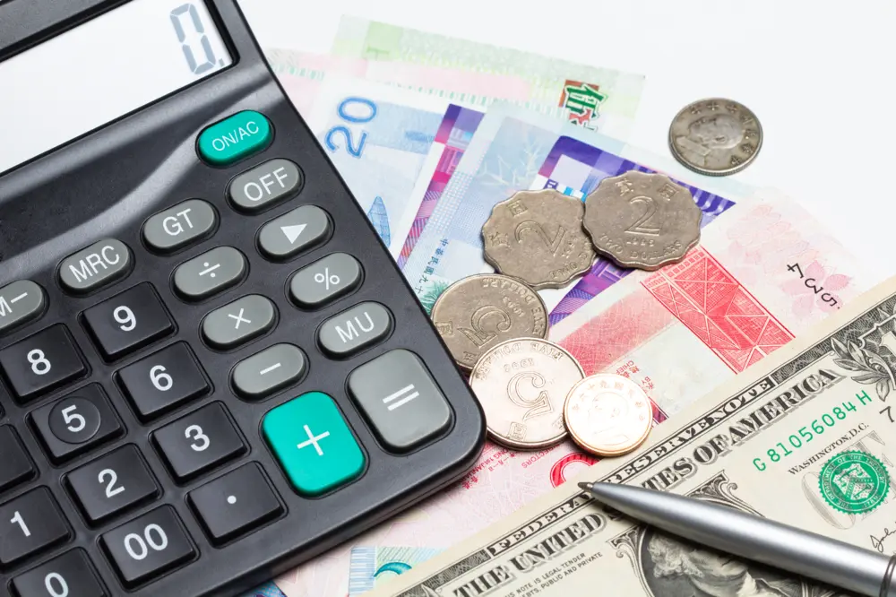 Travel budget planning with money and calculator