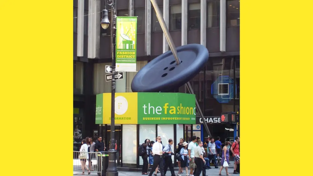The Button & Needle Sculpture in New York City, a popular fashion thing to do in New York.