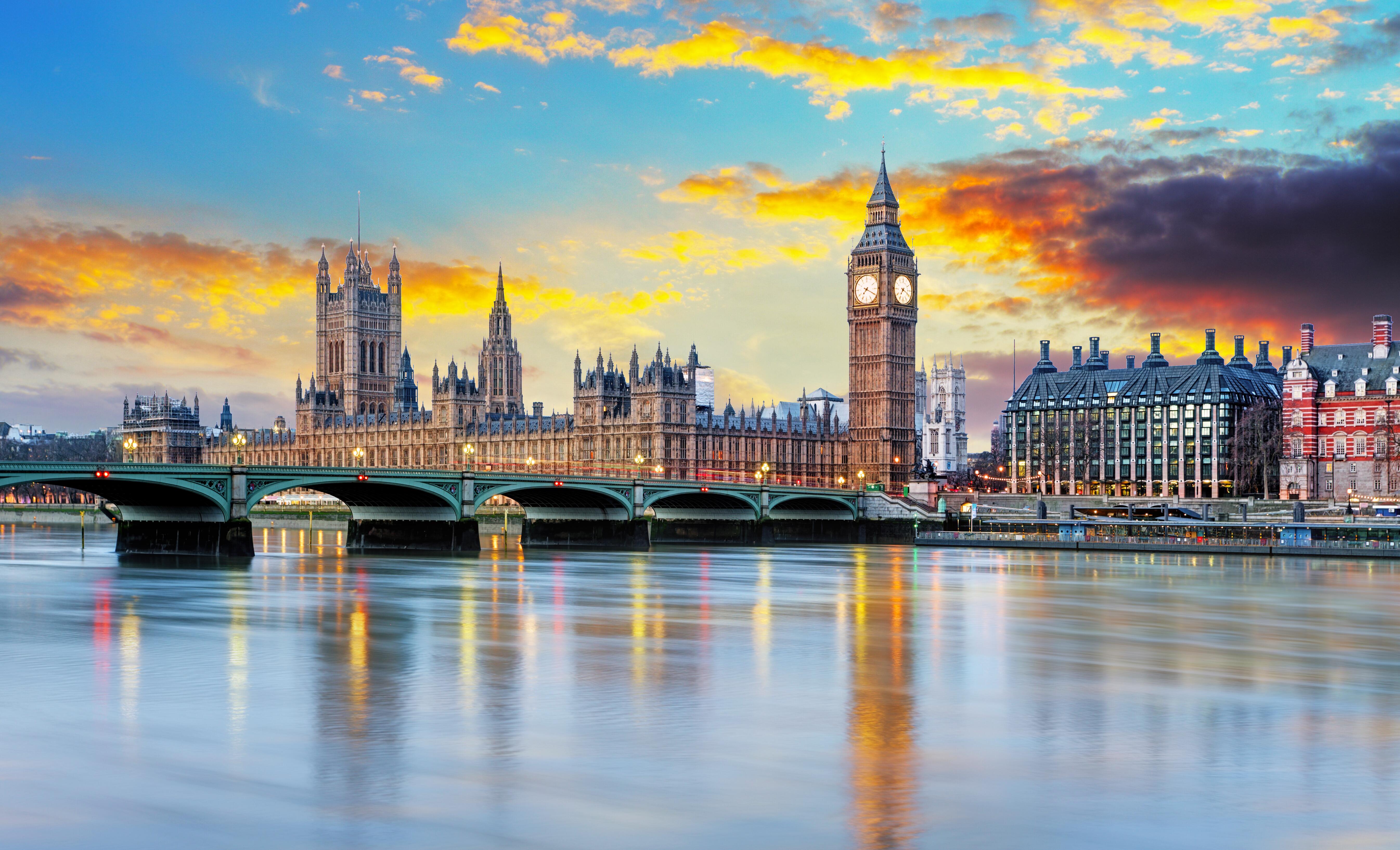 View of Westminster Bridge, Palace of Westminster and Big Ben on River Thames at sunset