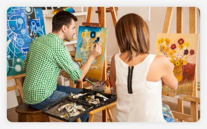 A couple taking a painting class together