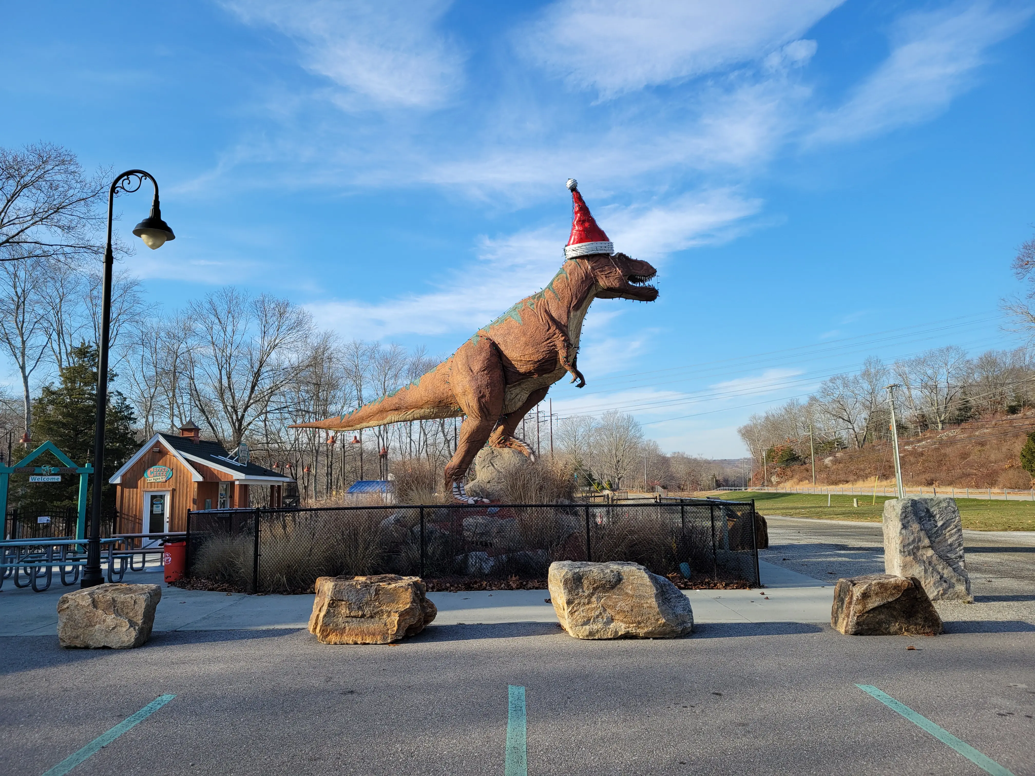 Image of the T-Rex statue in the parking lot of The Dinosaur Place.