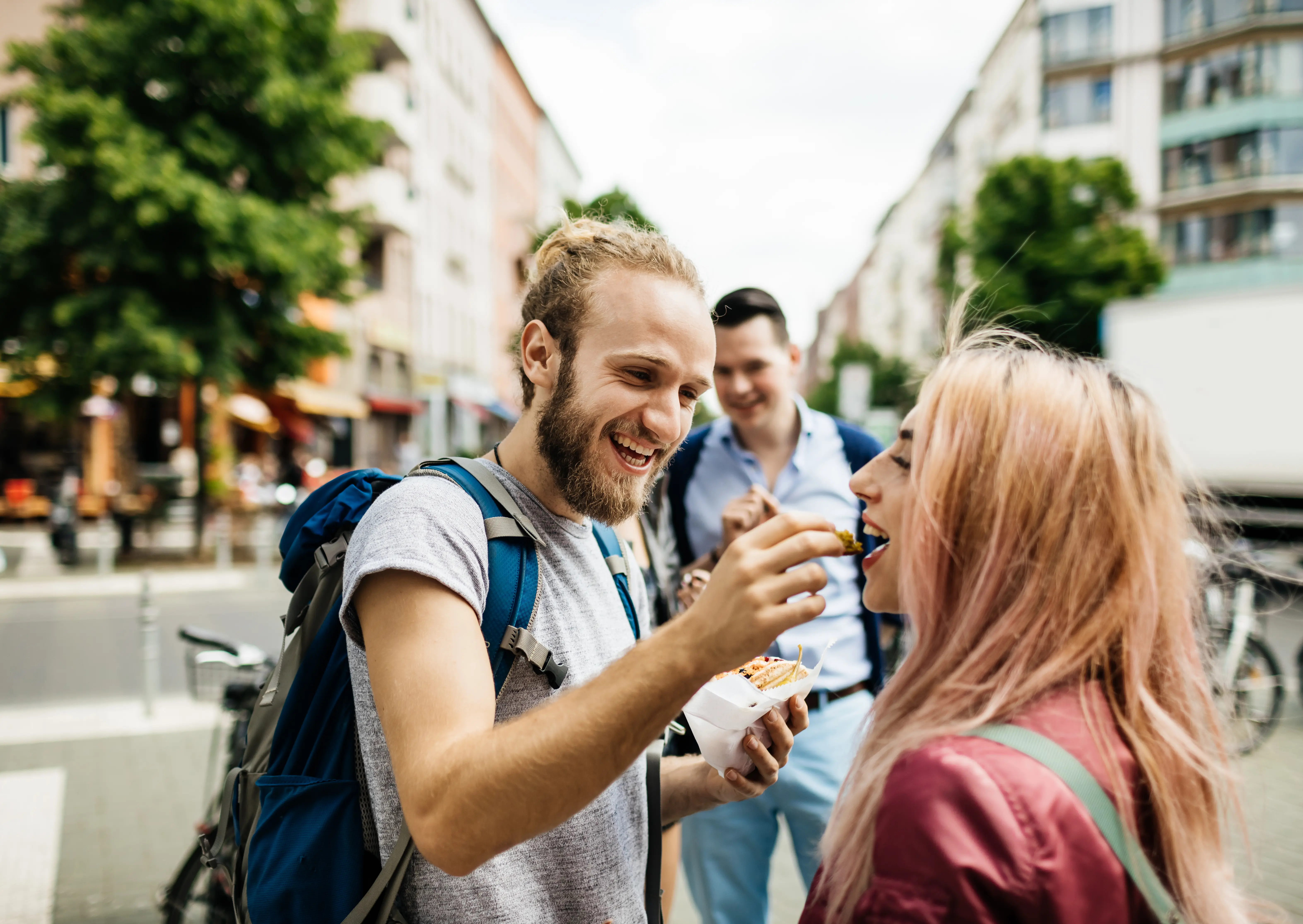 Photo of young man and woman on a food tour in the city