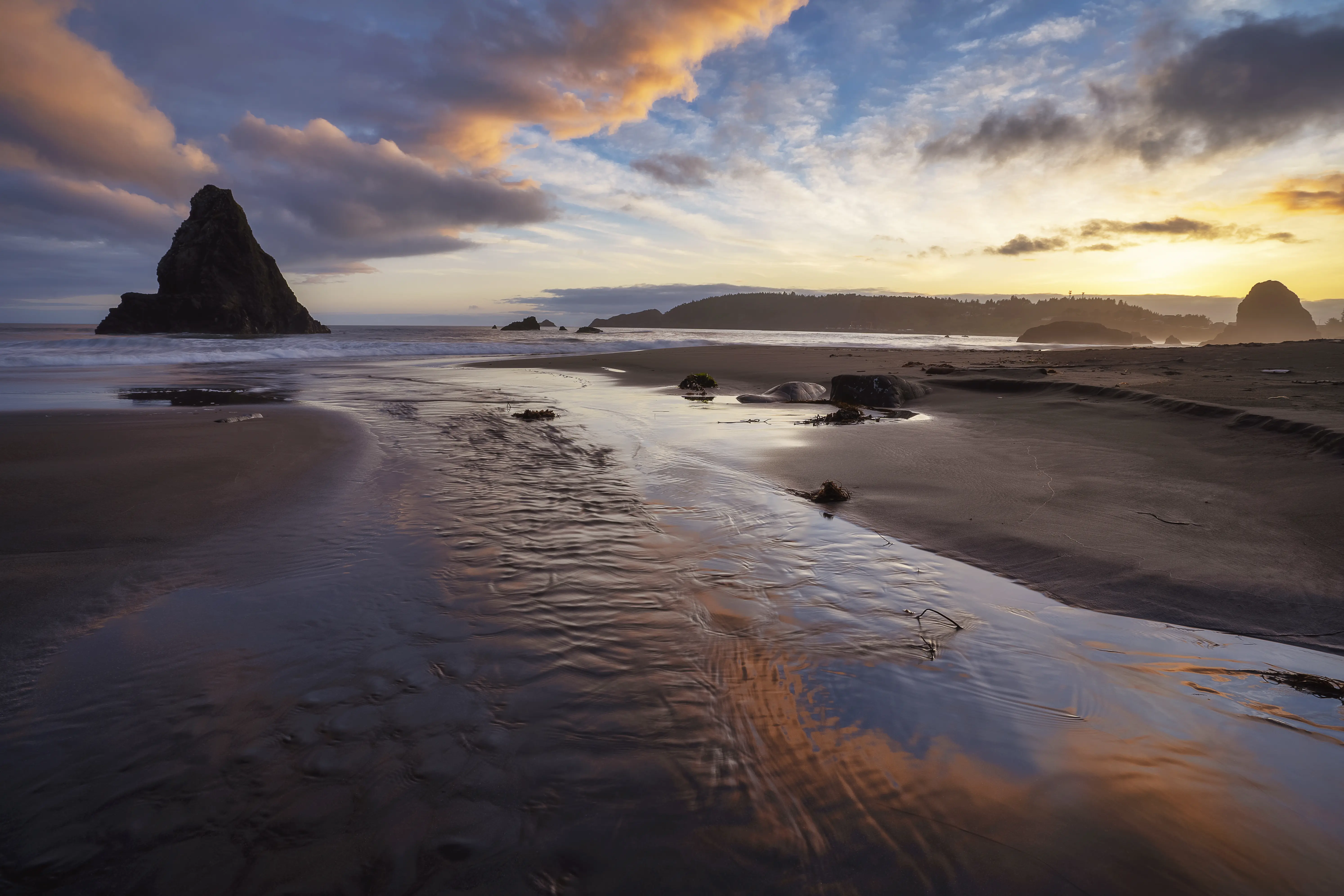 Outdoor image of Battle Rock at sunset, Port Orford, Oregon.