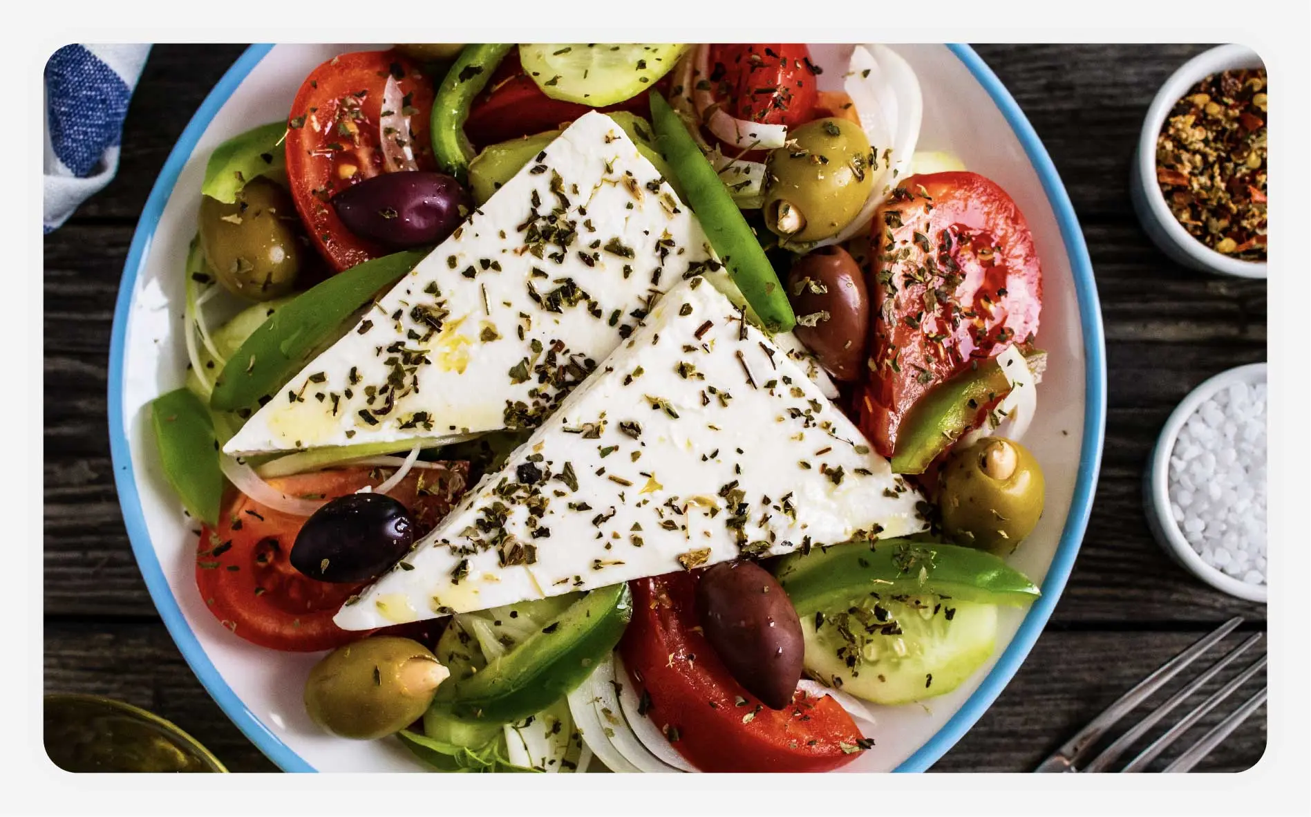 A plate with fresh feta and vegetables.