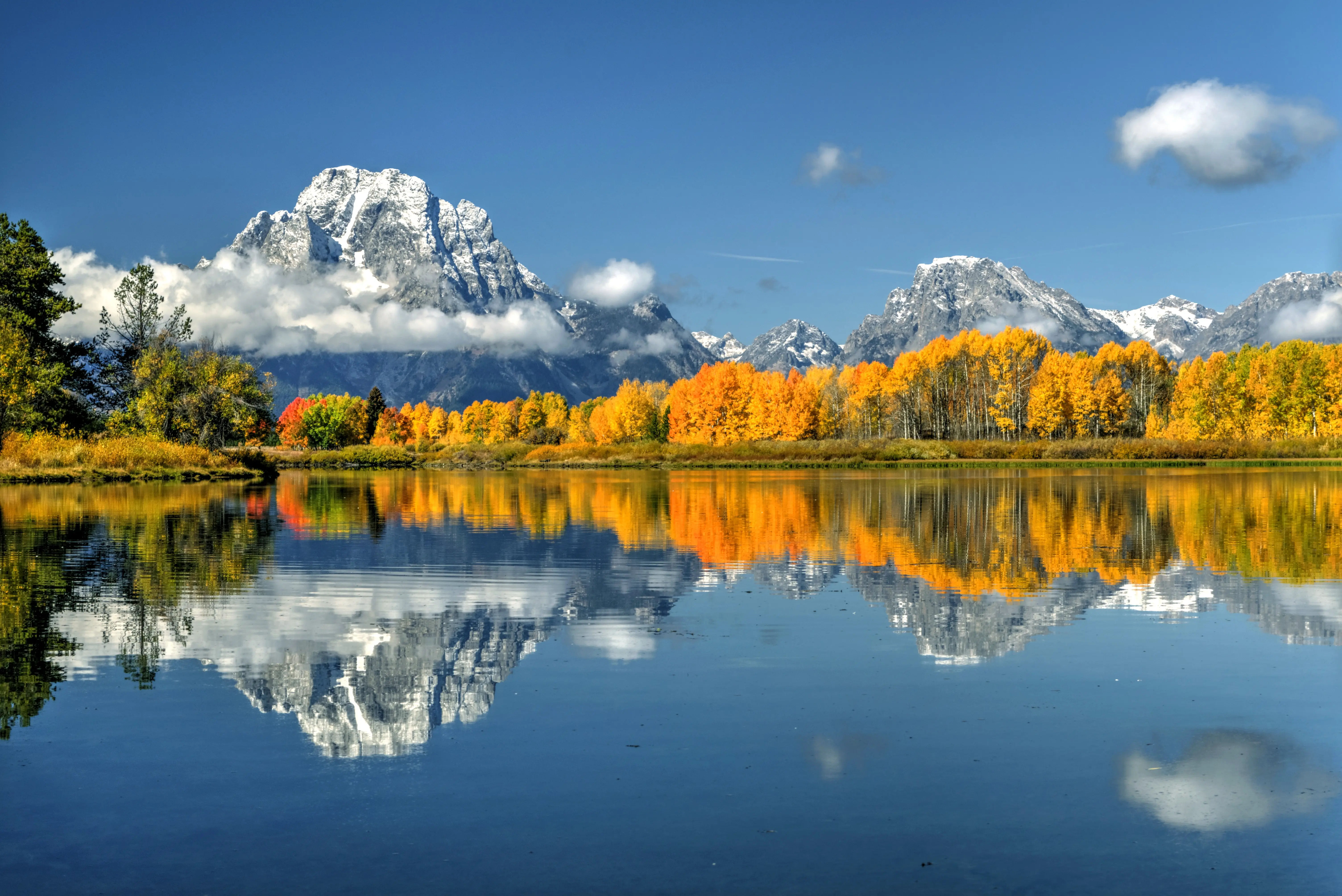 Autumn reflections along Oxbow Bend in Grand Teton National Park just after sunrise on a perfect September morning