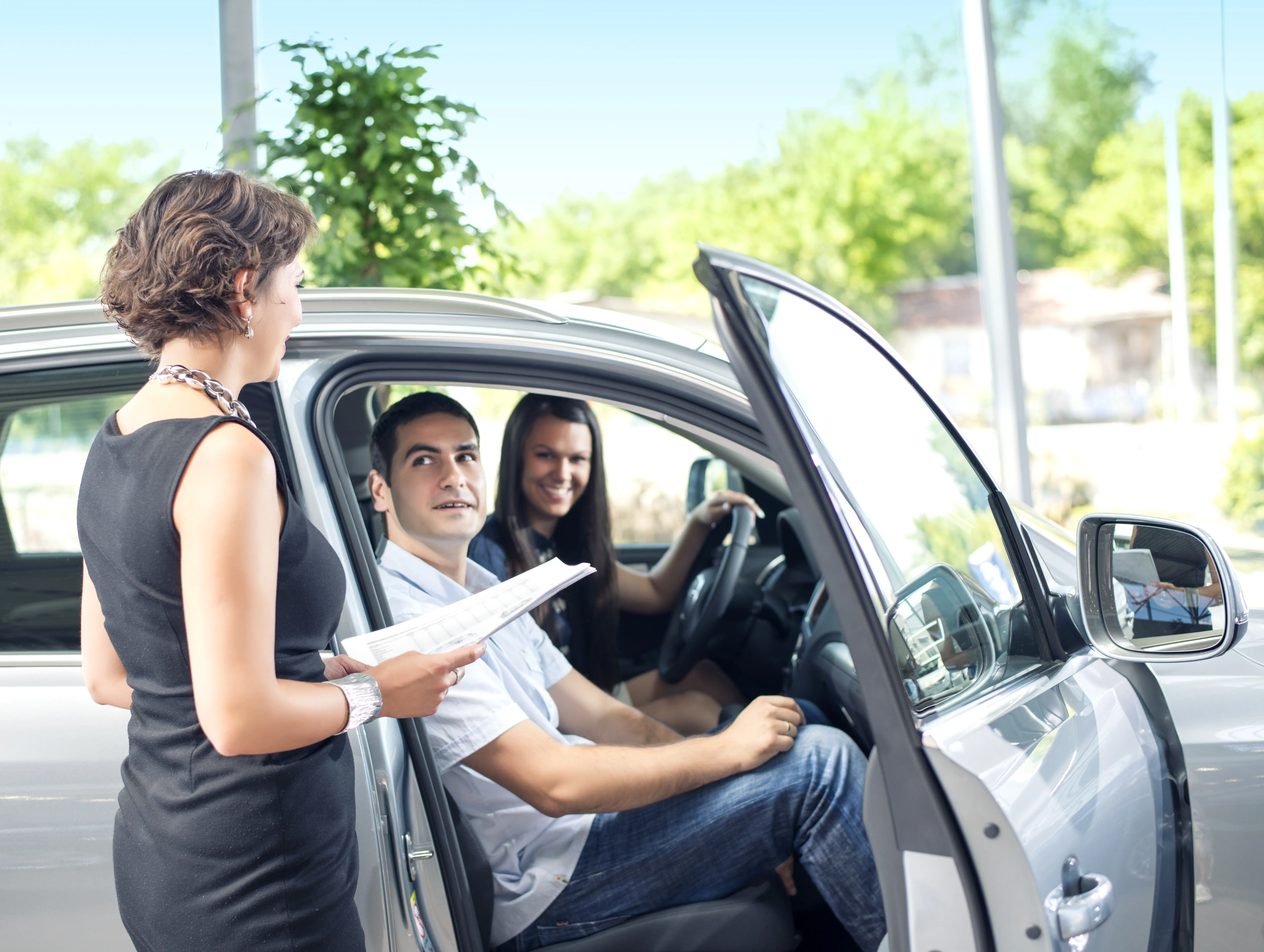 Couple renting a car while on travel
