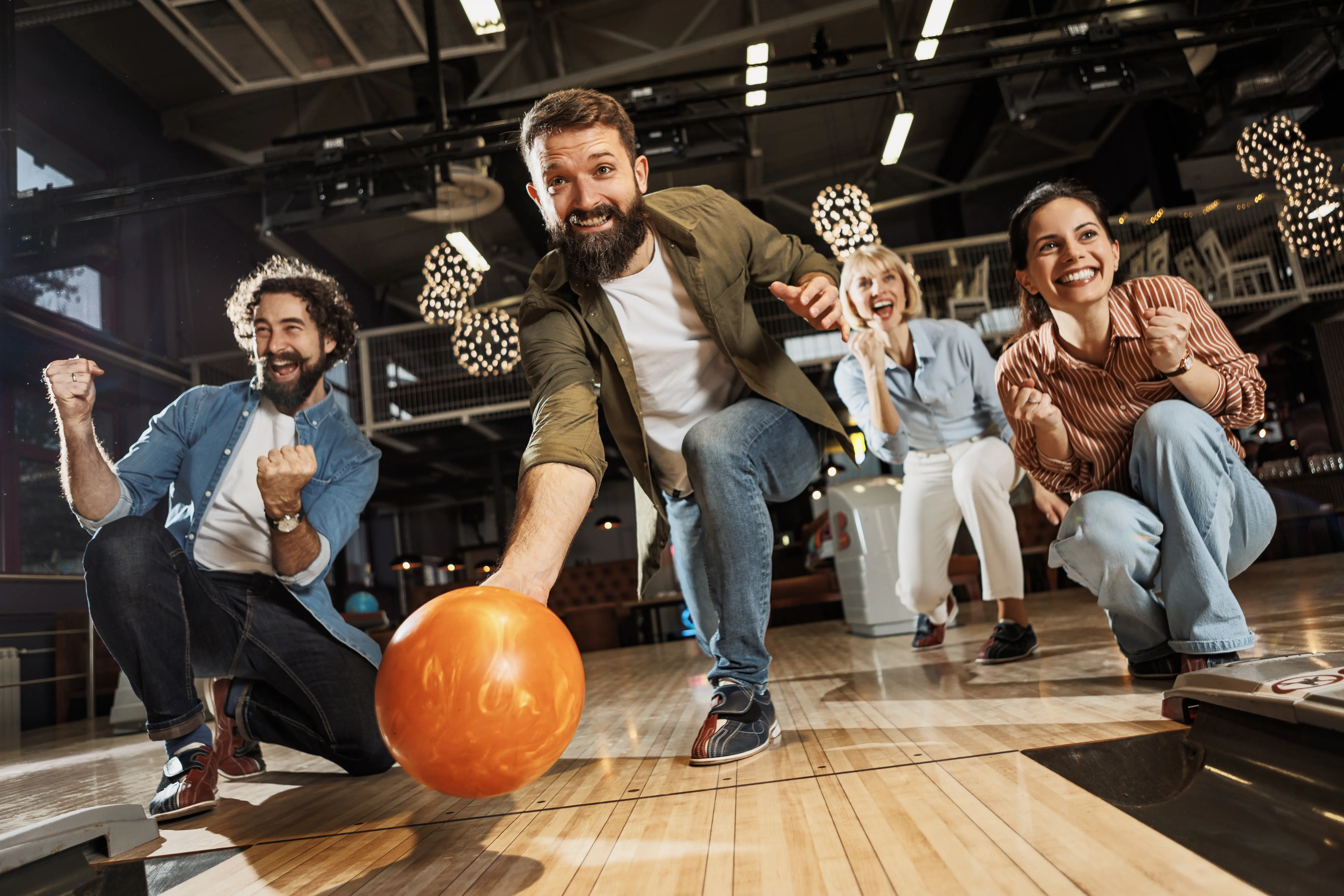 Image of a group of people bowling together.
