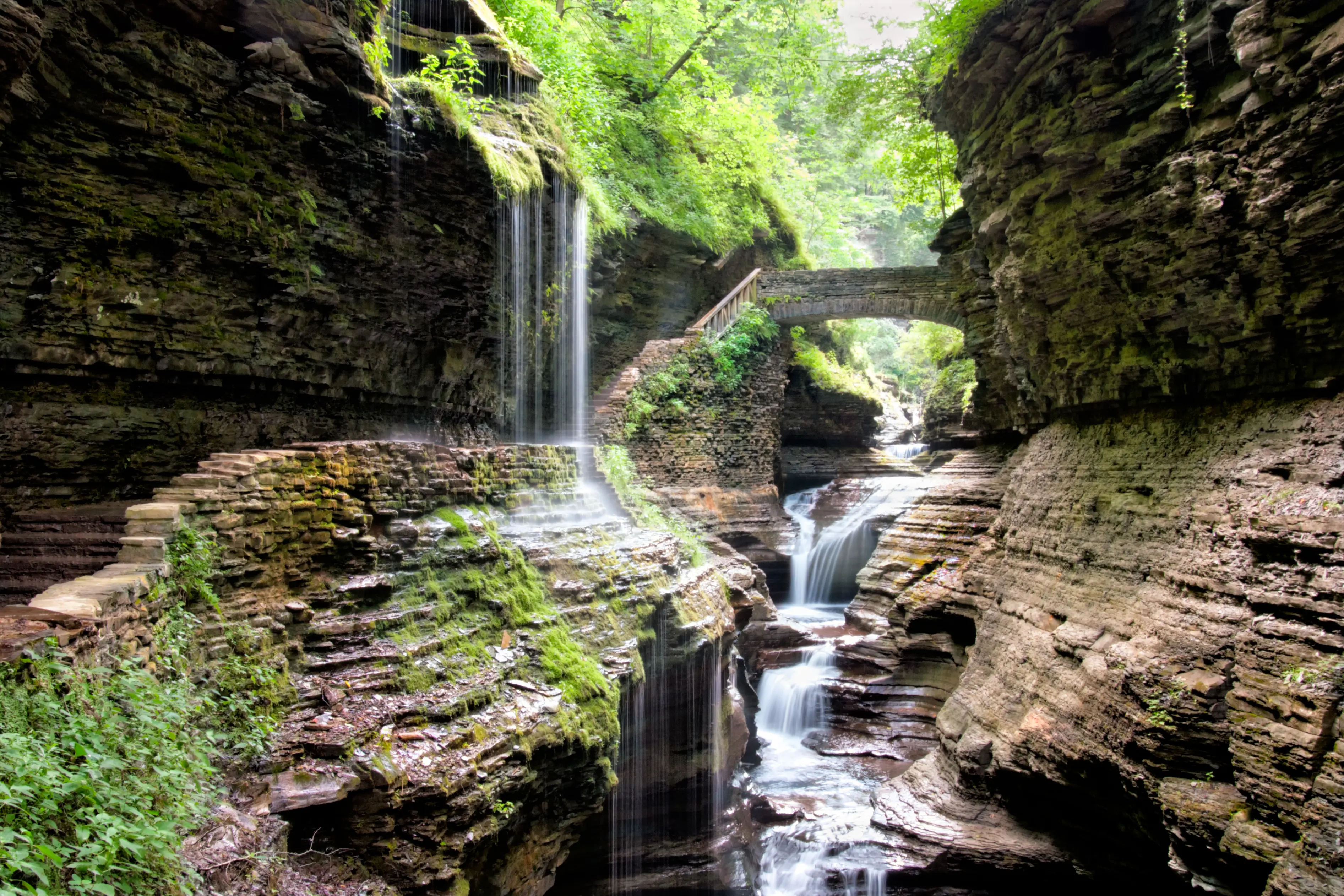 Bridge over waterfall in scenic Watkins Glen Gorge, New York, USA