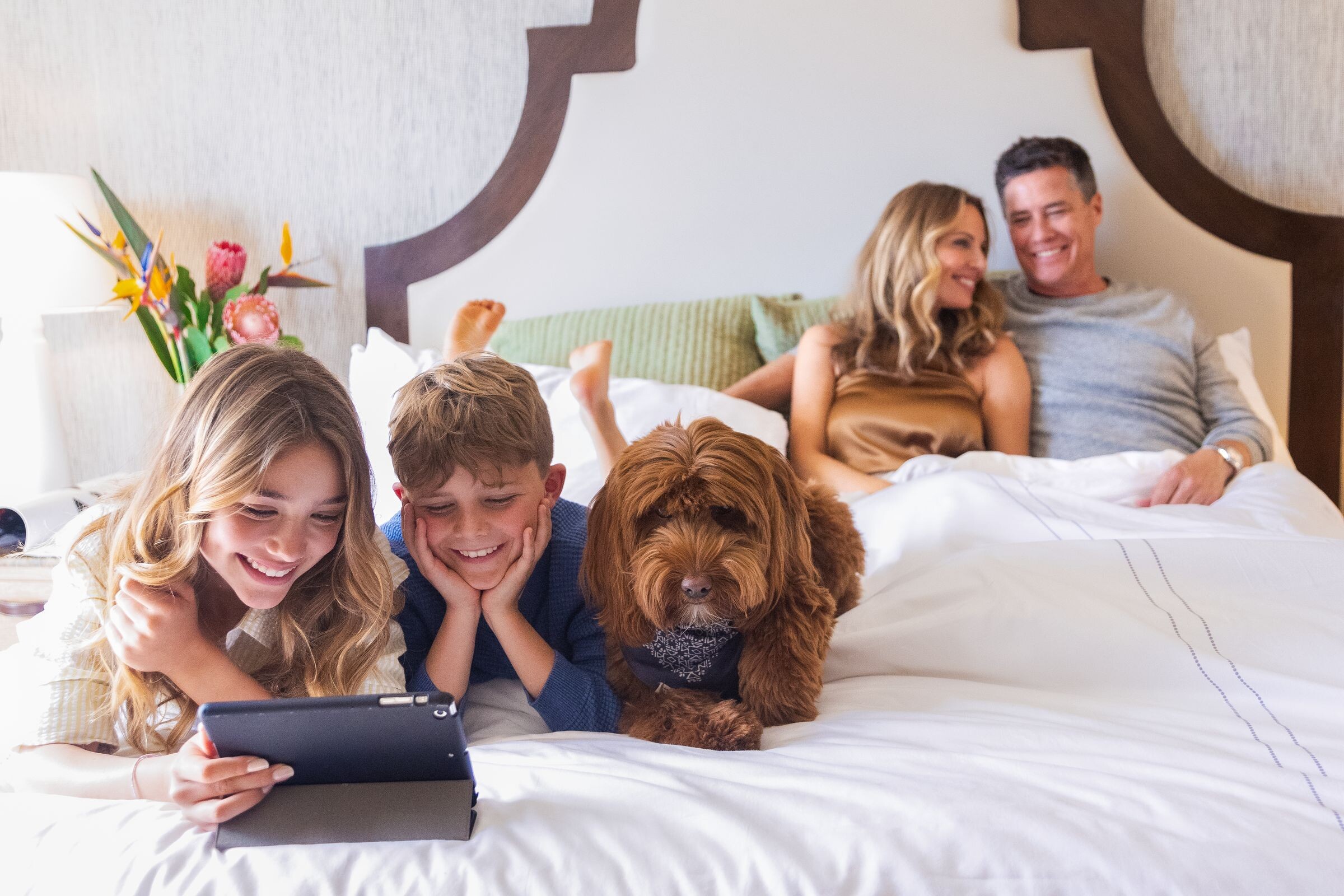Family relaxing with their dog at Omni Hotels and Resorts
