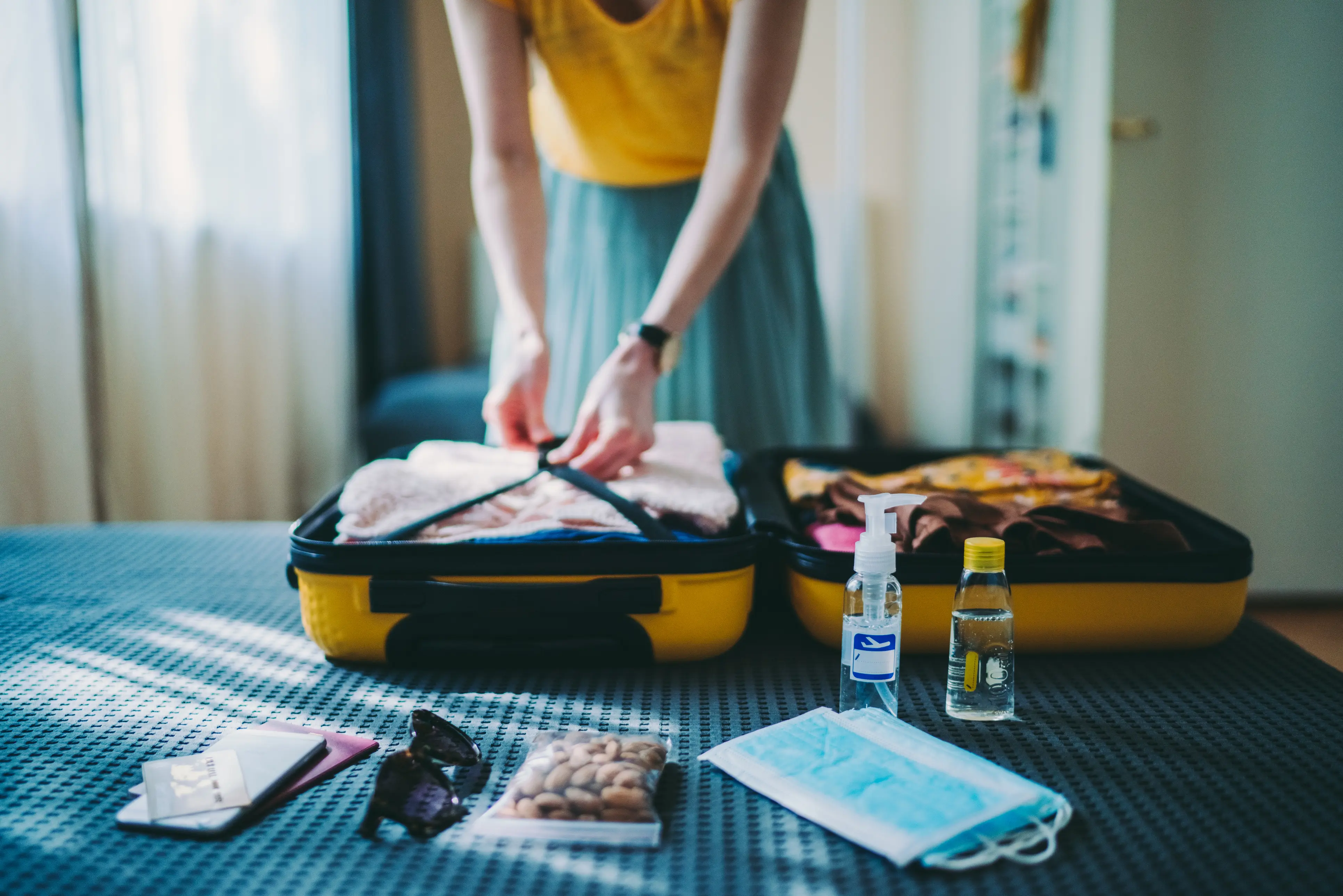Packing a suitcase for a trip during COVID19