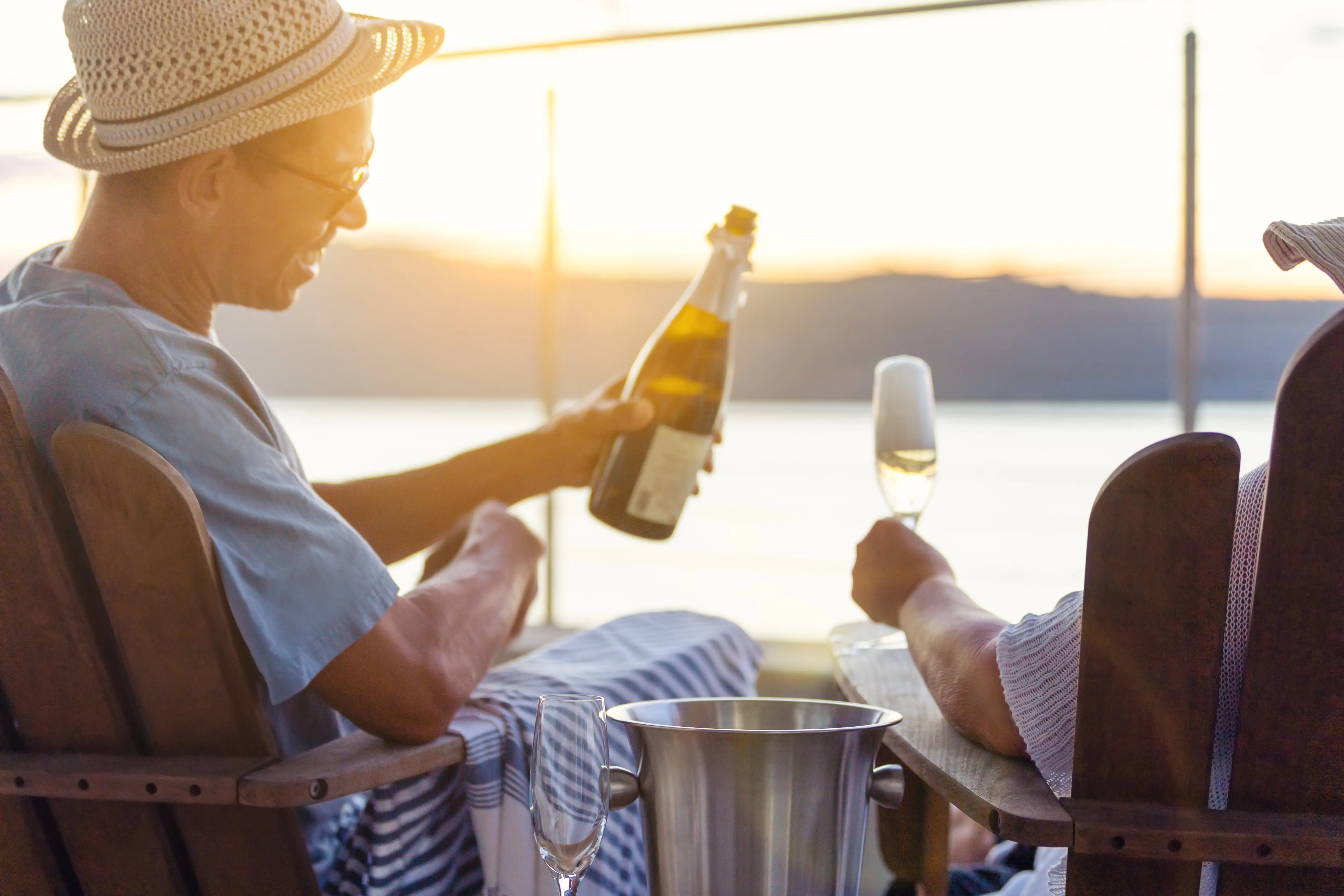 Image of a couple drinking champagne together on the deck of a cruise ship.