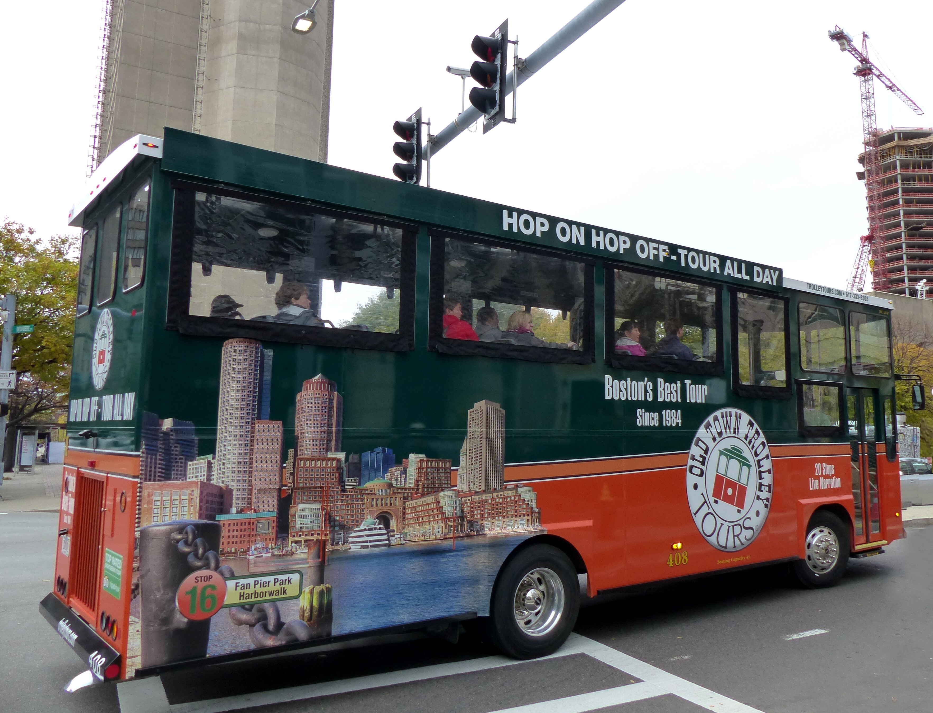 Image of an orange and green trolley tour vehicle in Boston.