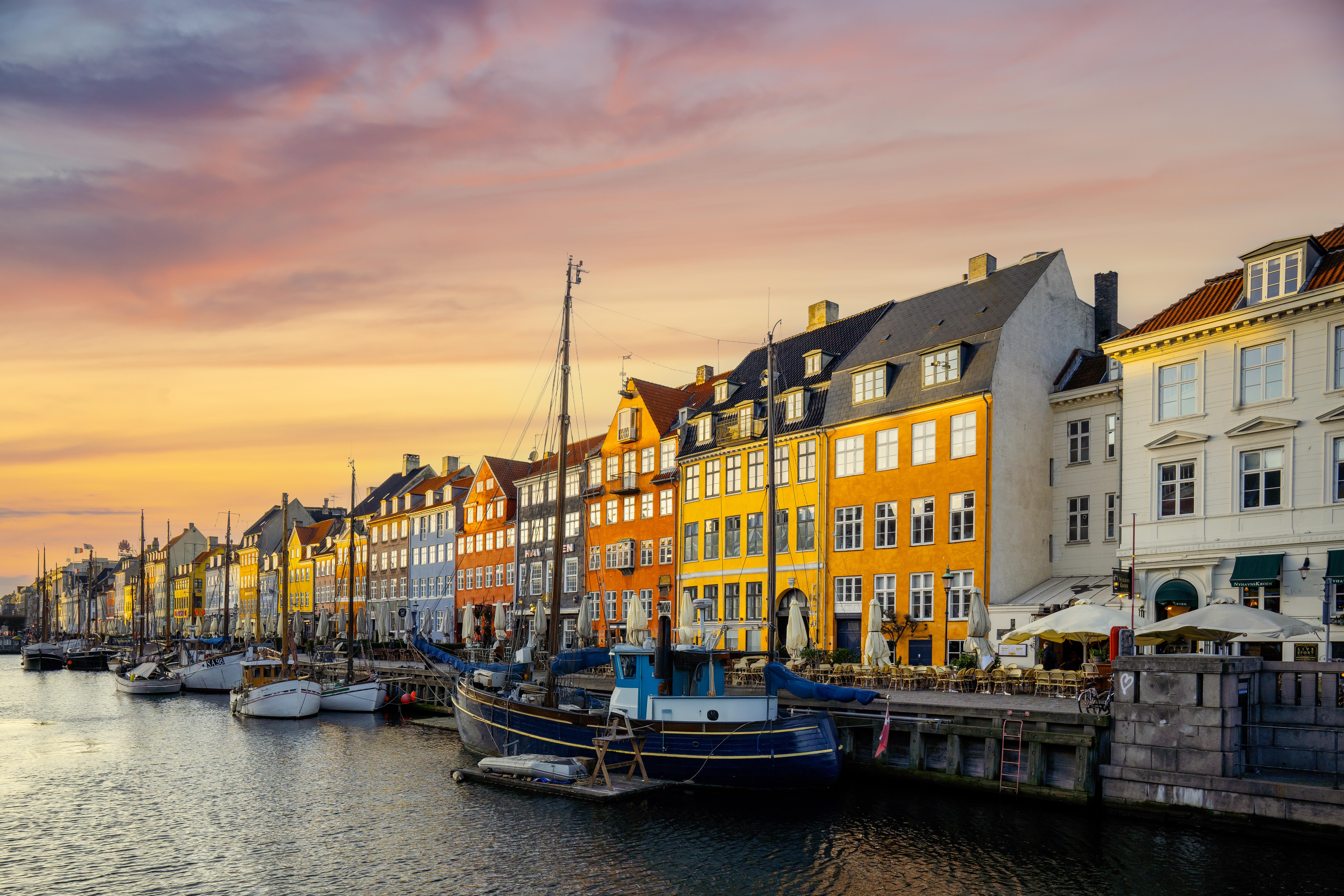Photo of the iconic waterfront with different colored houses in Copenhagen, Denmark