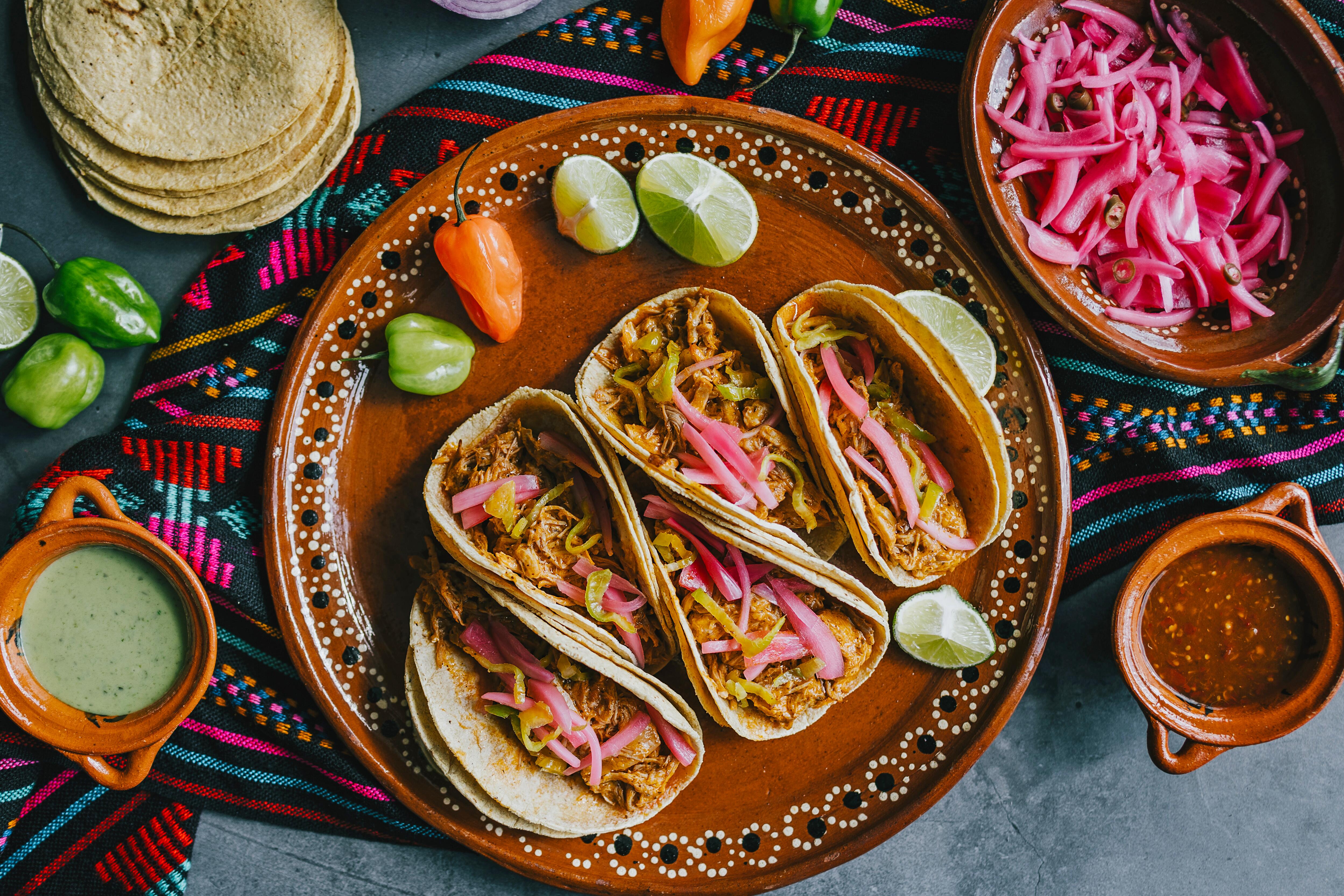 Cochinita pibil tacos with corn tortillas, pickled red onions and habanero chili