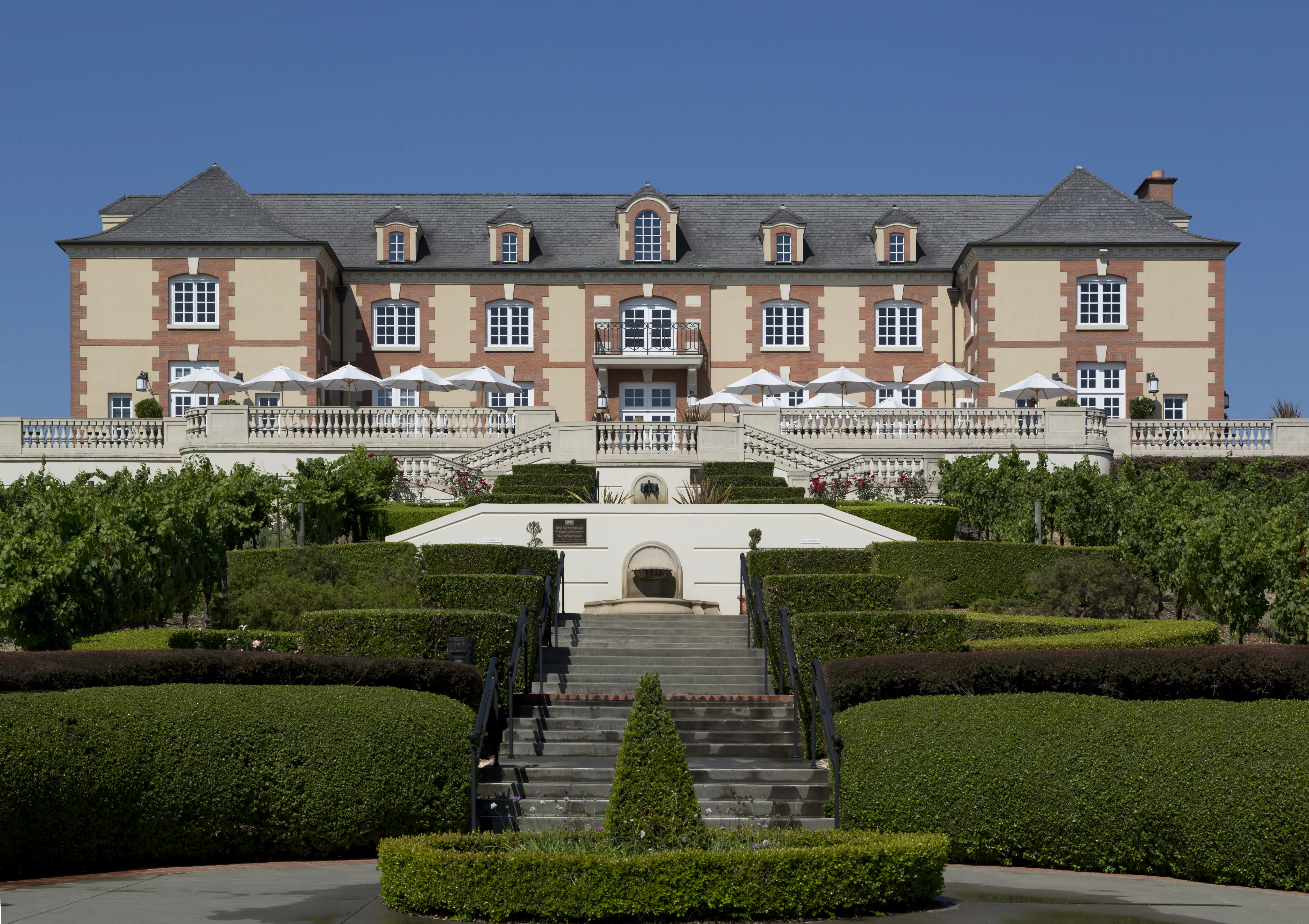 Exterior image of the building and grounds of Domaine Carneros winery and chateau.