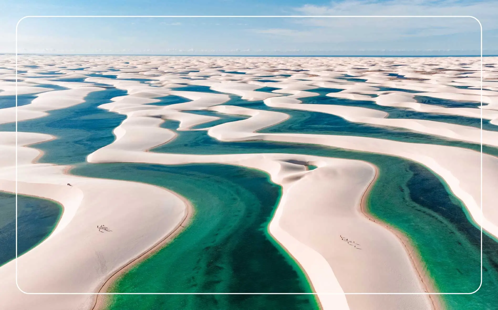 Rolling sand dunes and lakes in Lençóis Maranhenses National Park, Brazil.