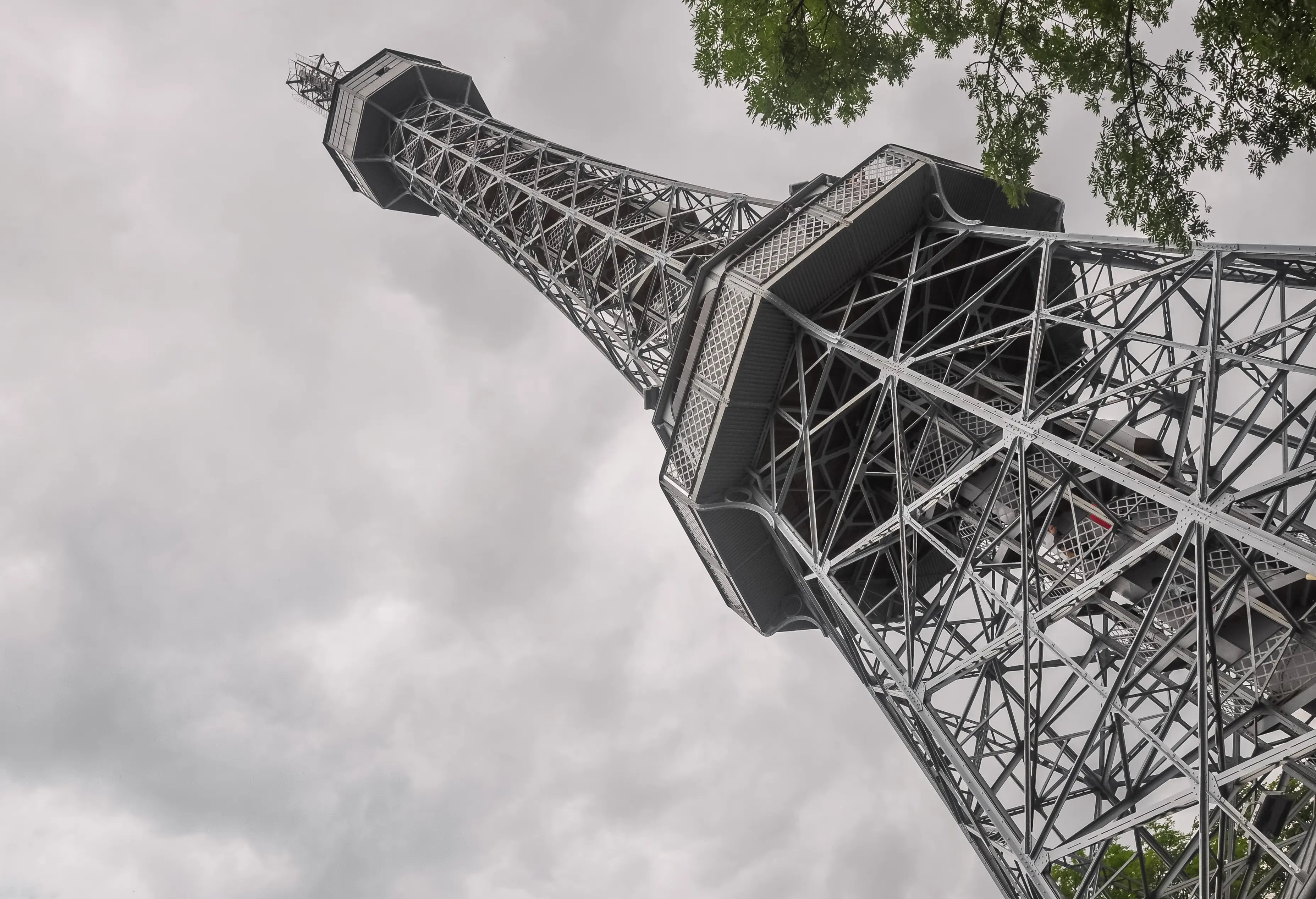 Ground level image of Petrin Tower in Prague.